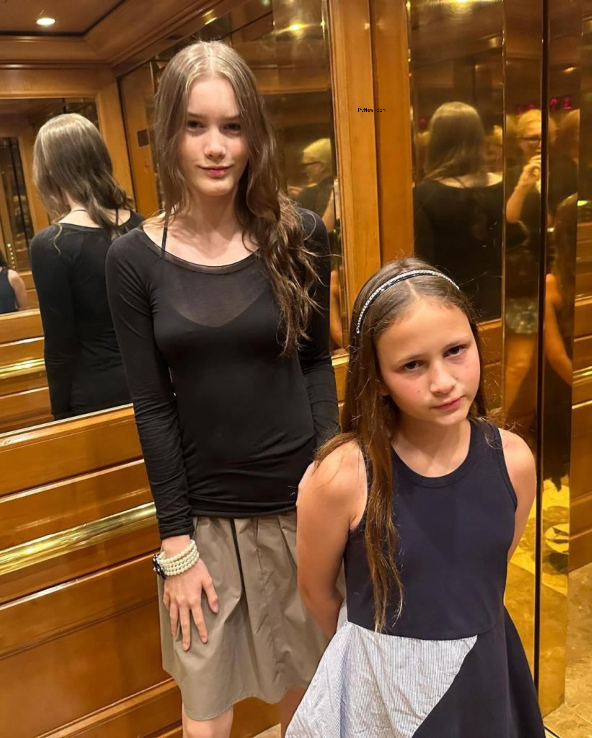 alice evans' daughters standing in an elevator
