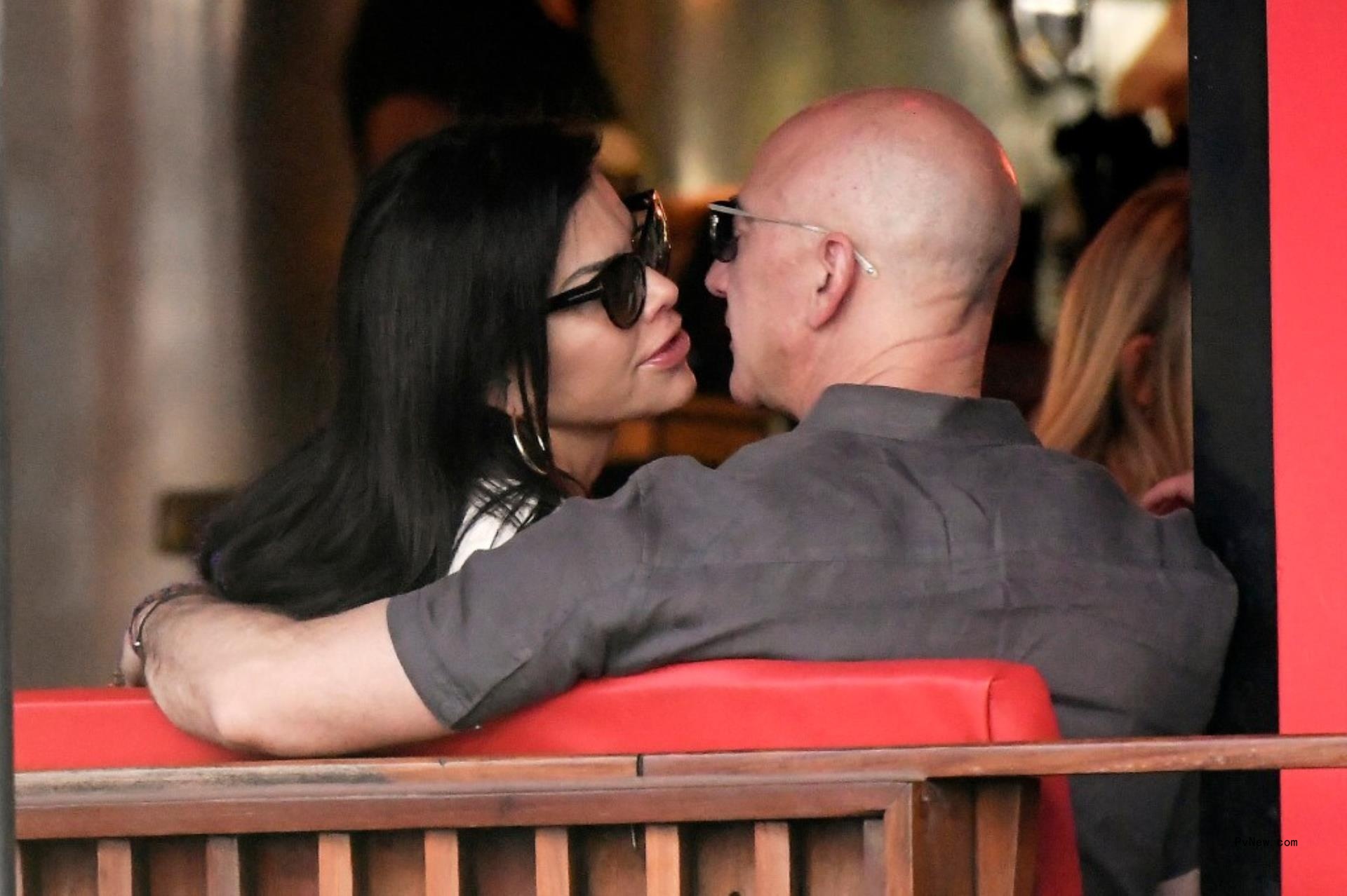 Jeff Bezos and Lauren Sánchez a<i></i>bout to share a kiss.