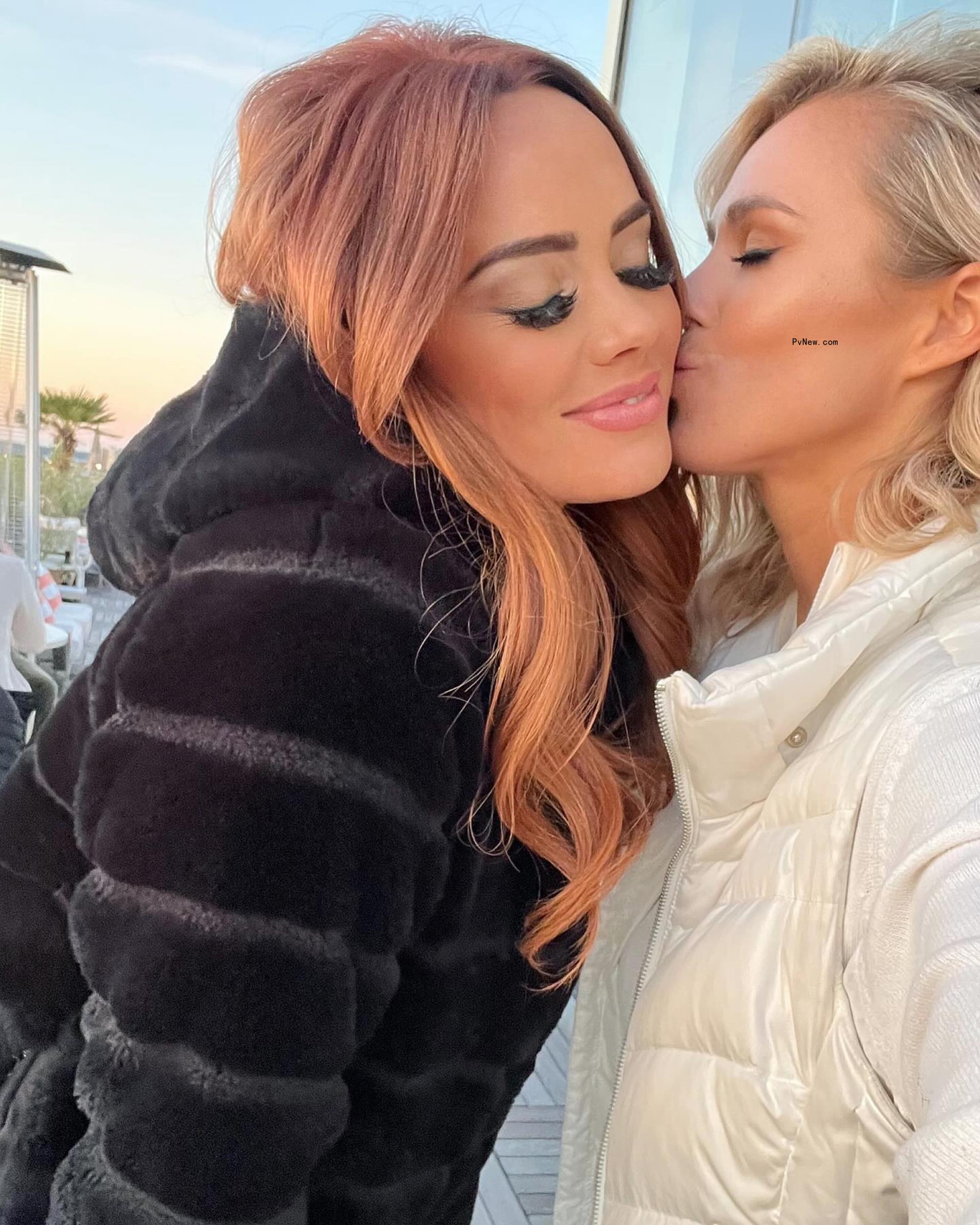 Olivia Flowers kissing Kathryn Dennis on the cheek