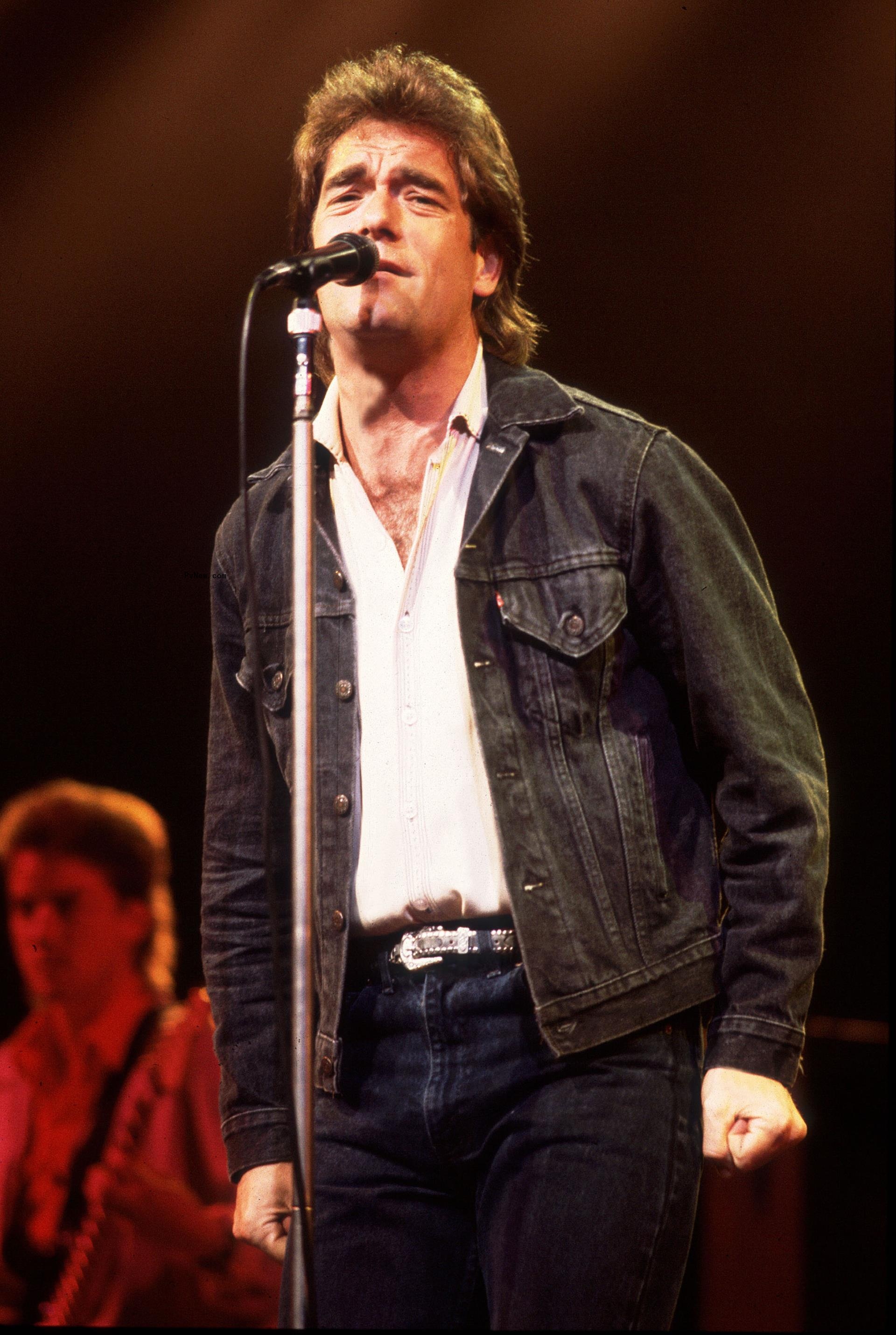 Huey Lewis performing.