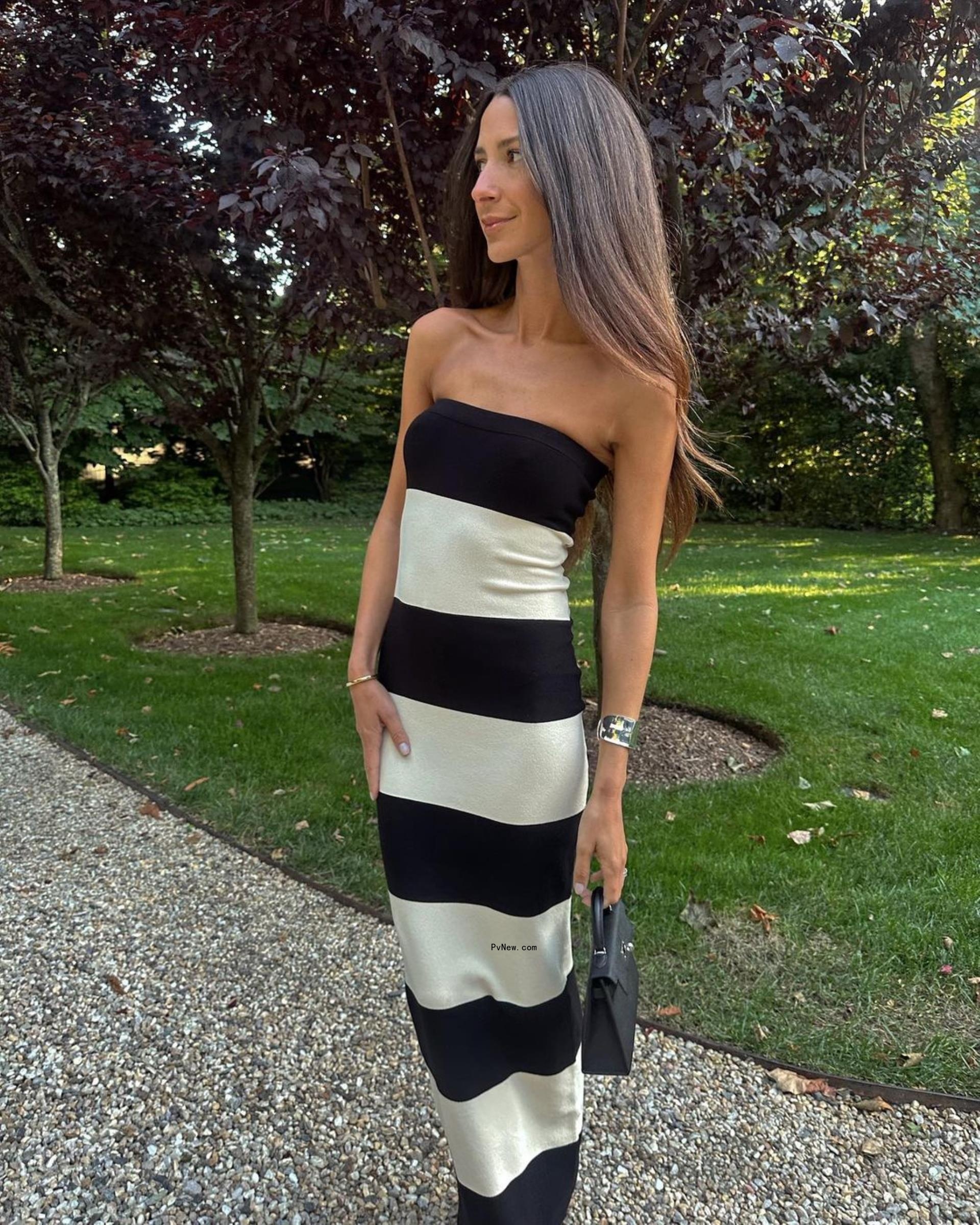 Arielle Charnas in a striped dress
