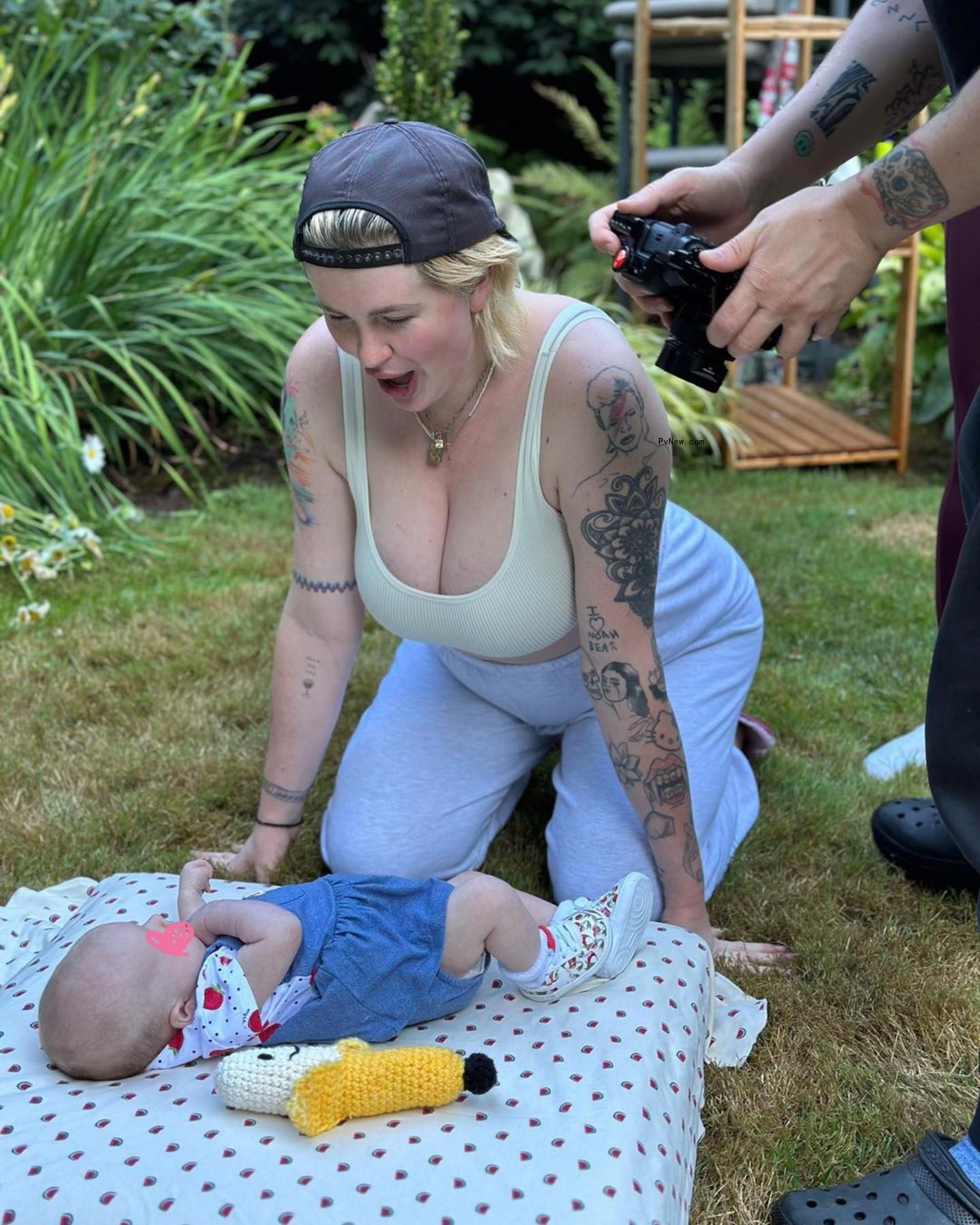 Ireland Baldwin smiling at her daughter, Holland.