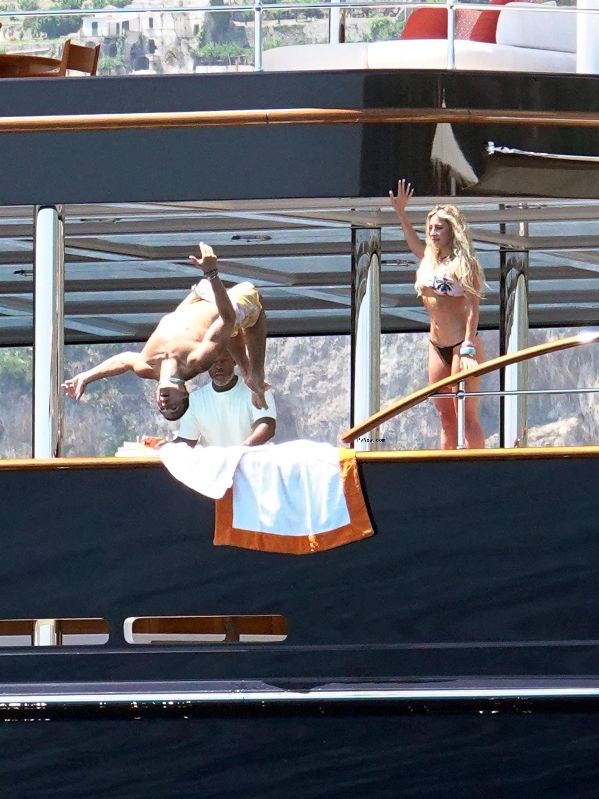 Lauren's son Nikko Go<i></i>nzalez diving off the yacht.