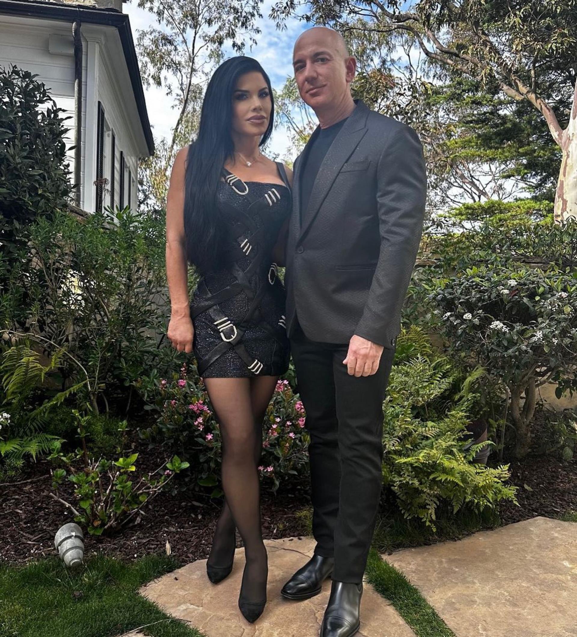 Lauren Sánchez and Jeff Bezos in black.