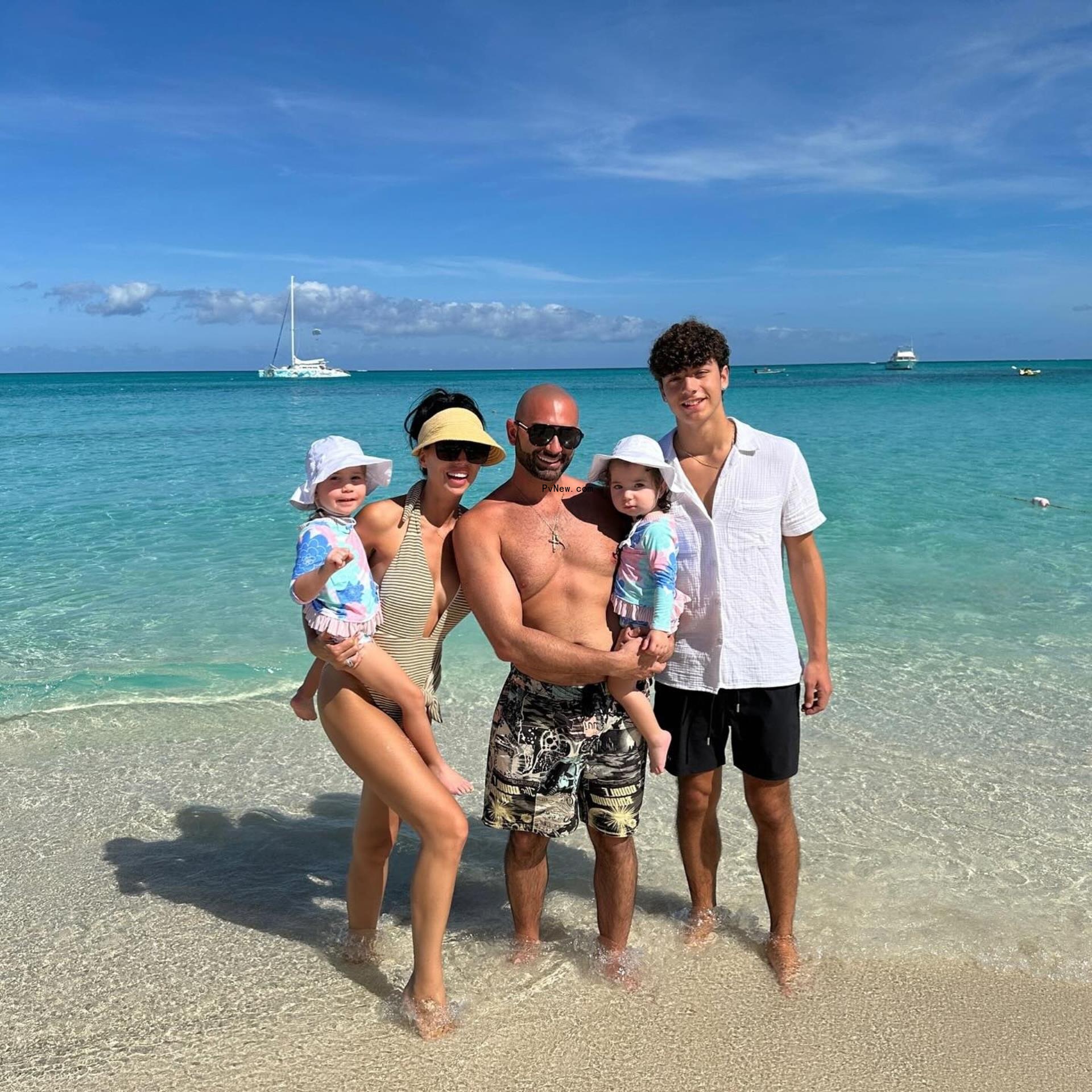 Rachel and John Fuda posing with kids Gianella, Giuliana and Jaiden