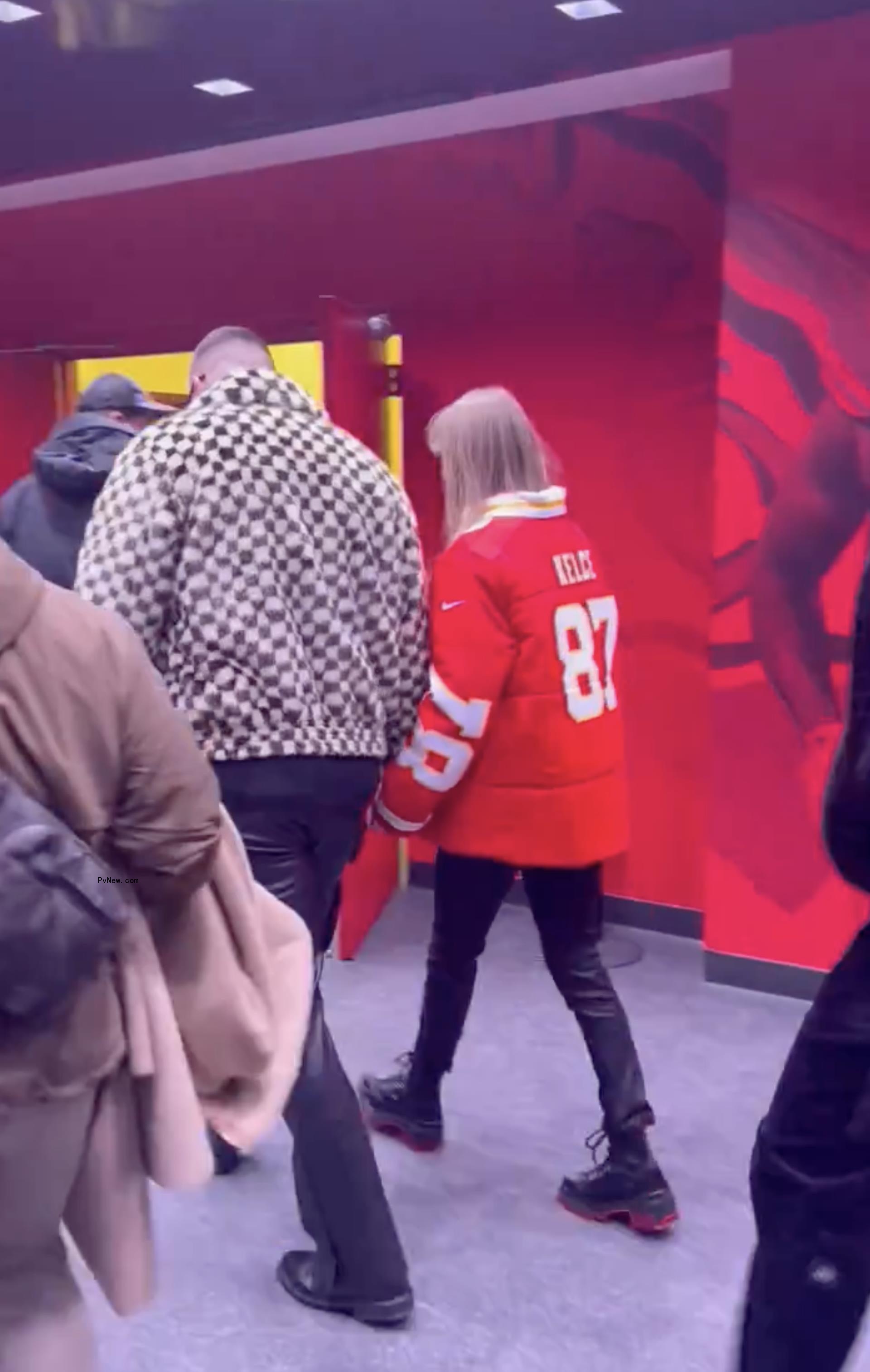 Taylor Swift was seen still wearing her custom Chiefs puffer jacket while leaving.
