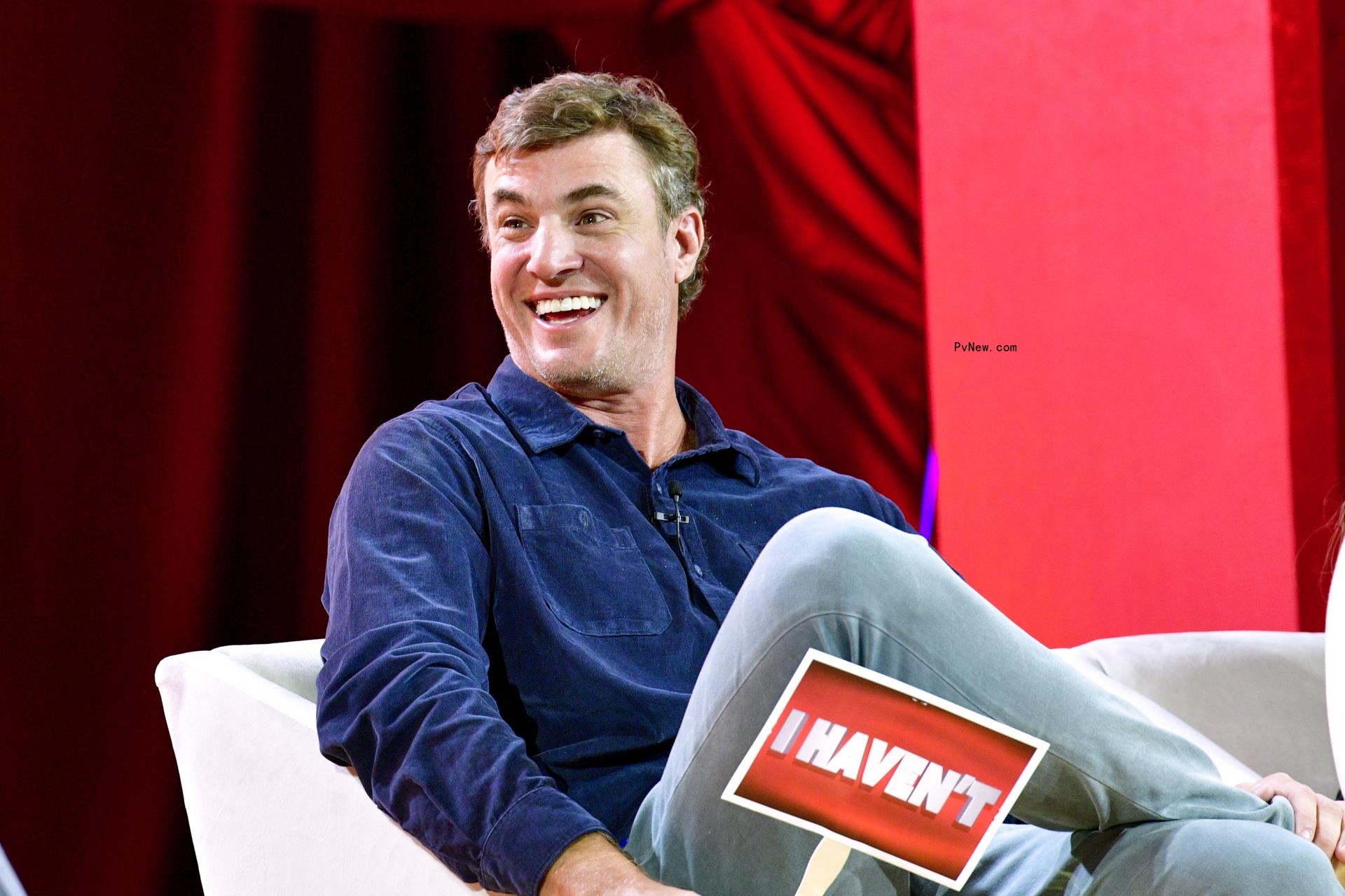 Shep Rose sitting in a chair