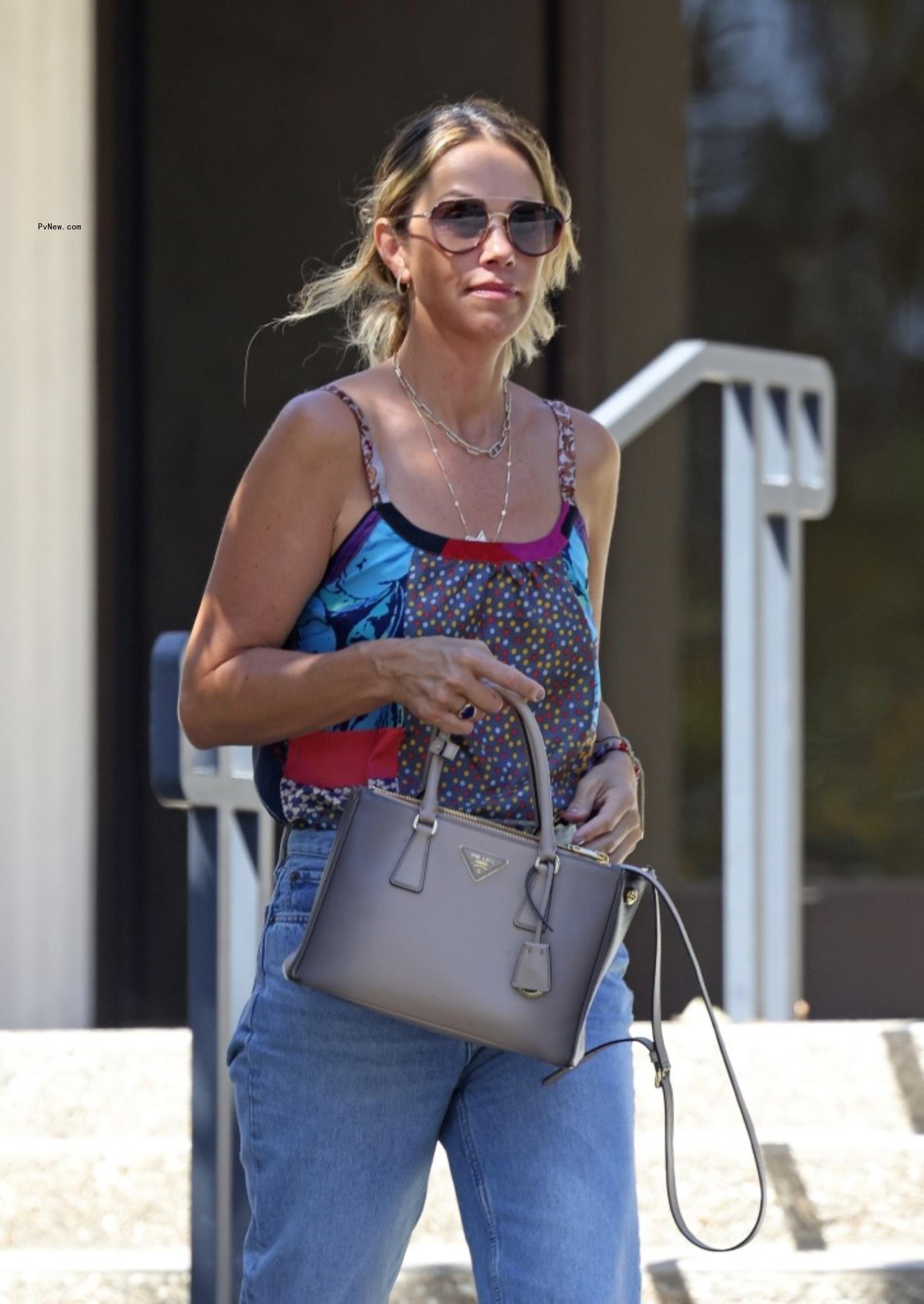 Christine Baumgartner leaving the bank.