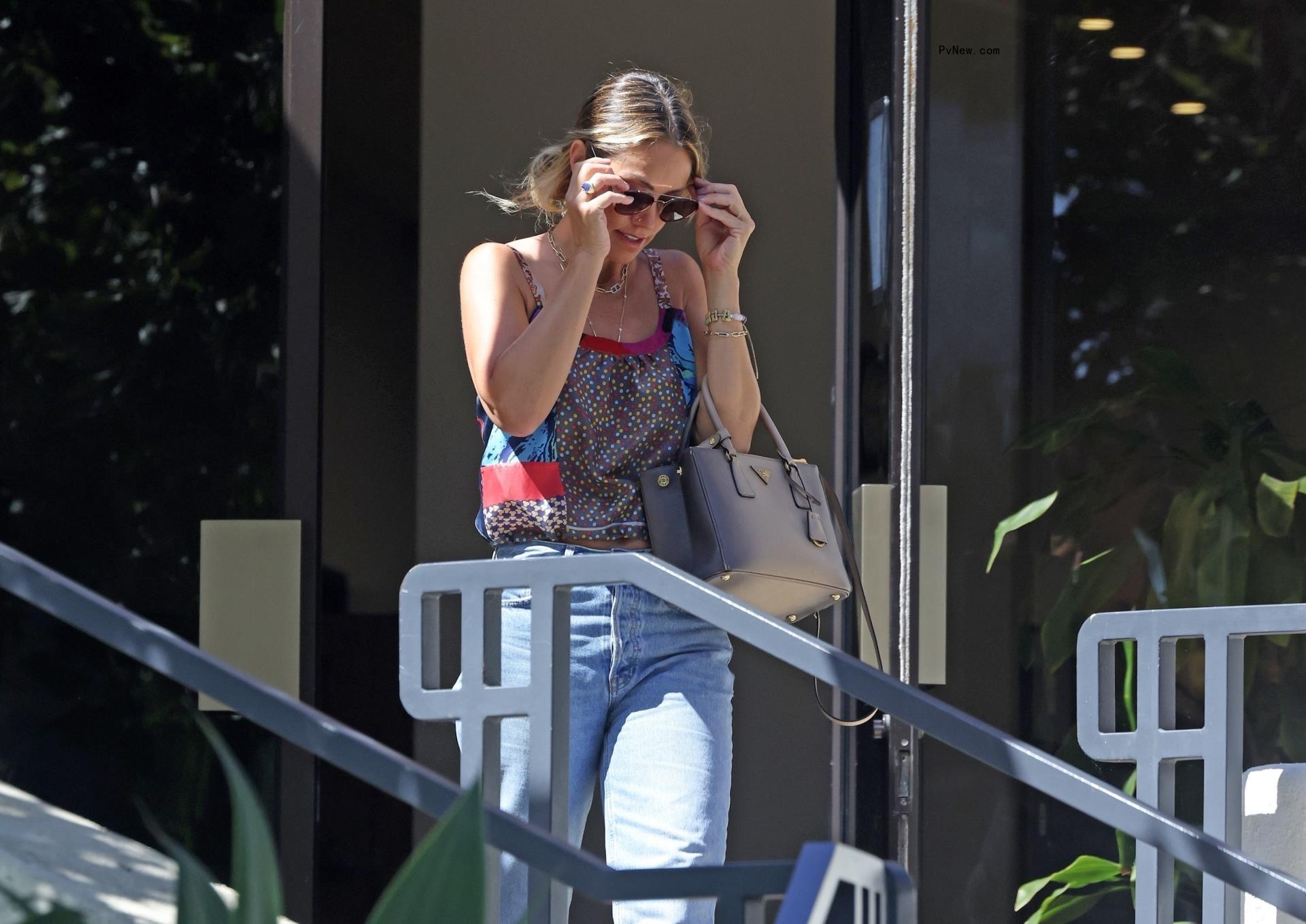 Christine Baumgartner leaving the bank.