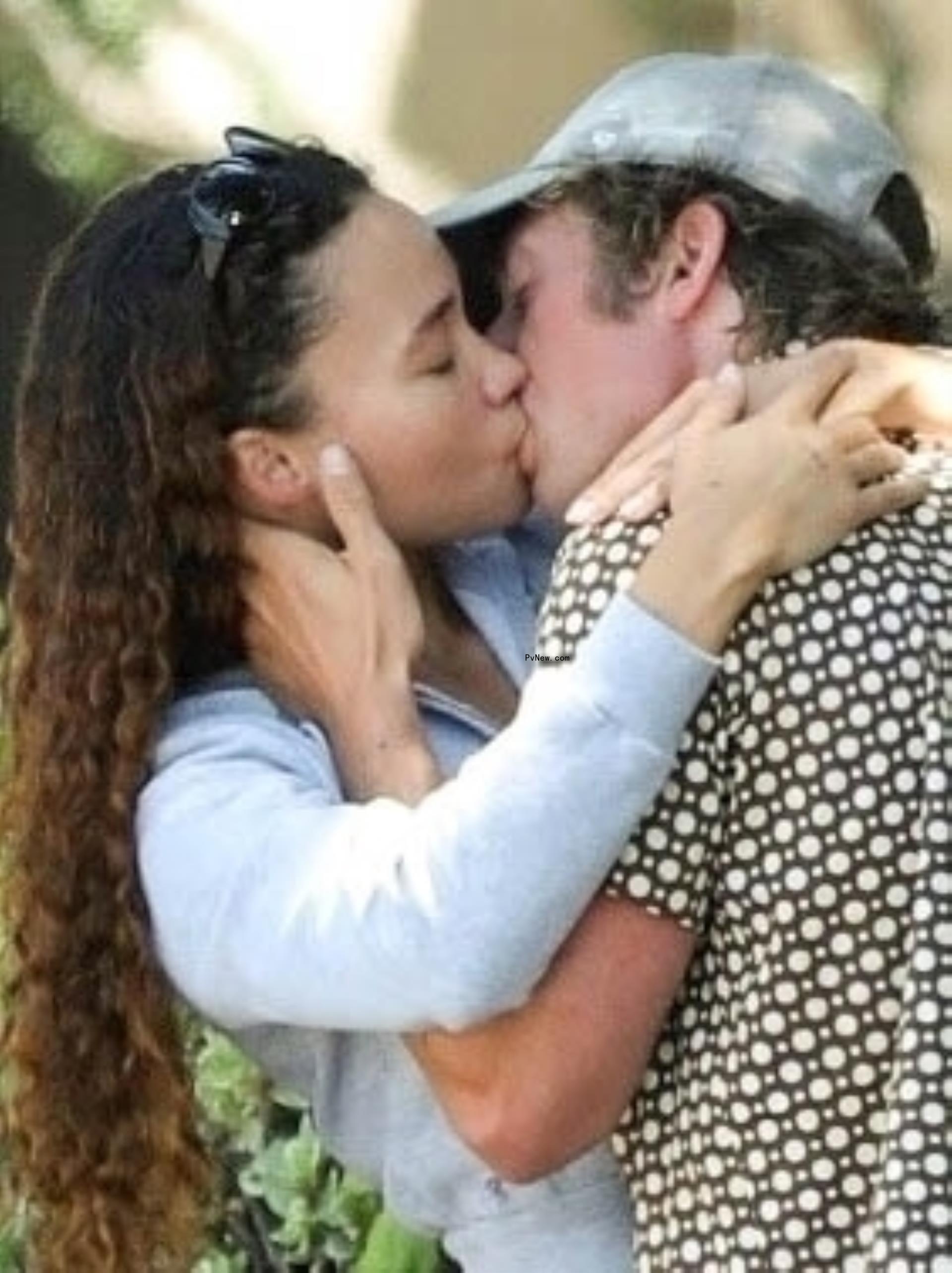 Jeremy Allen White kissing Ashley Moore.