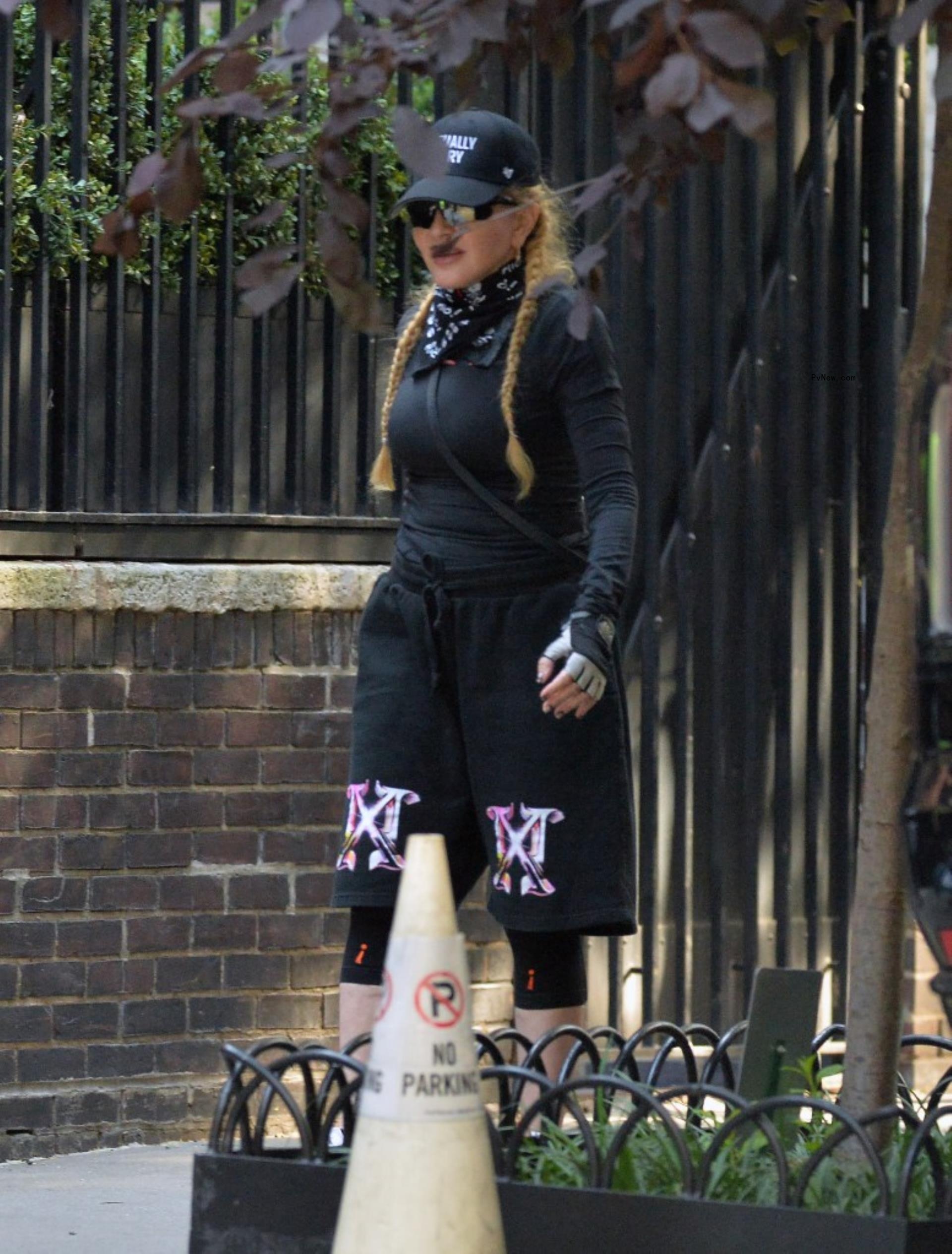 Mado<i></i>nna walking in New York City.