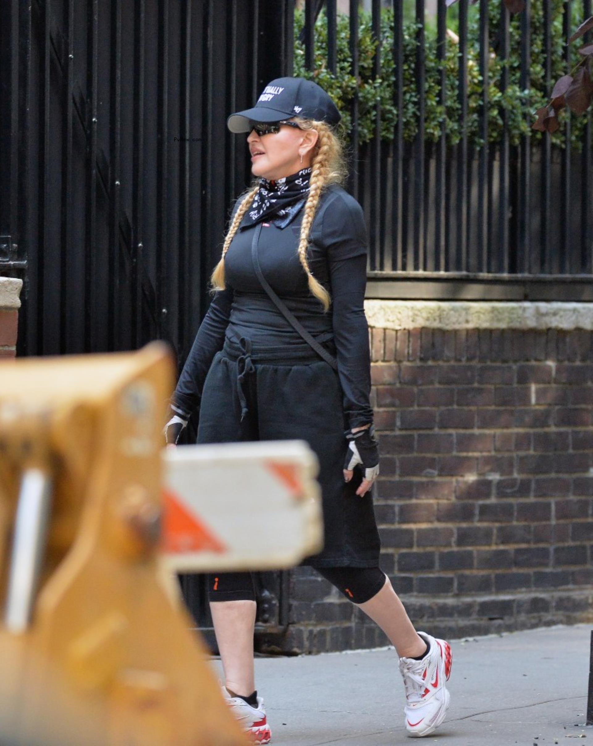 Mado<i></i>nna walking in New York City.
