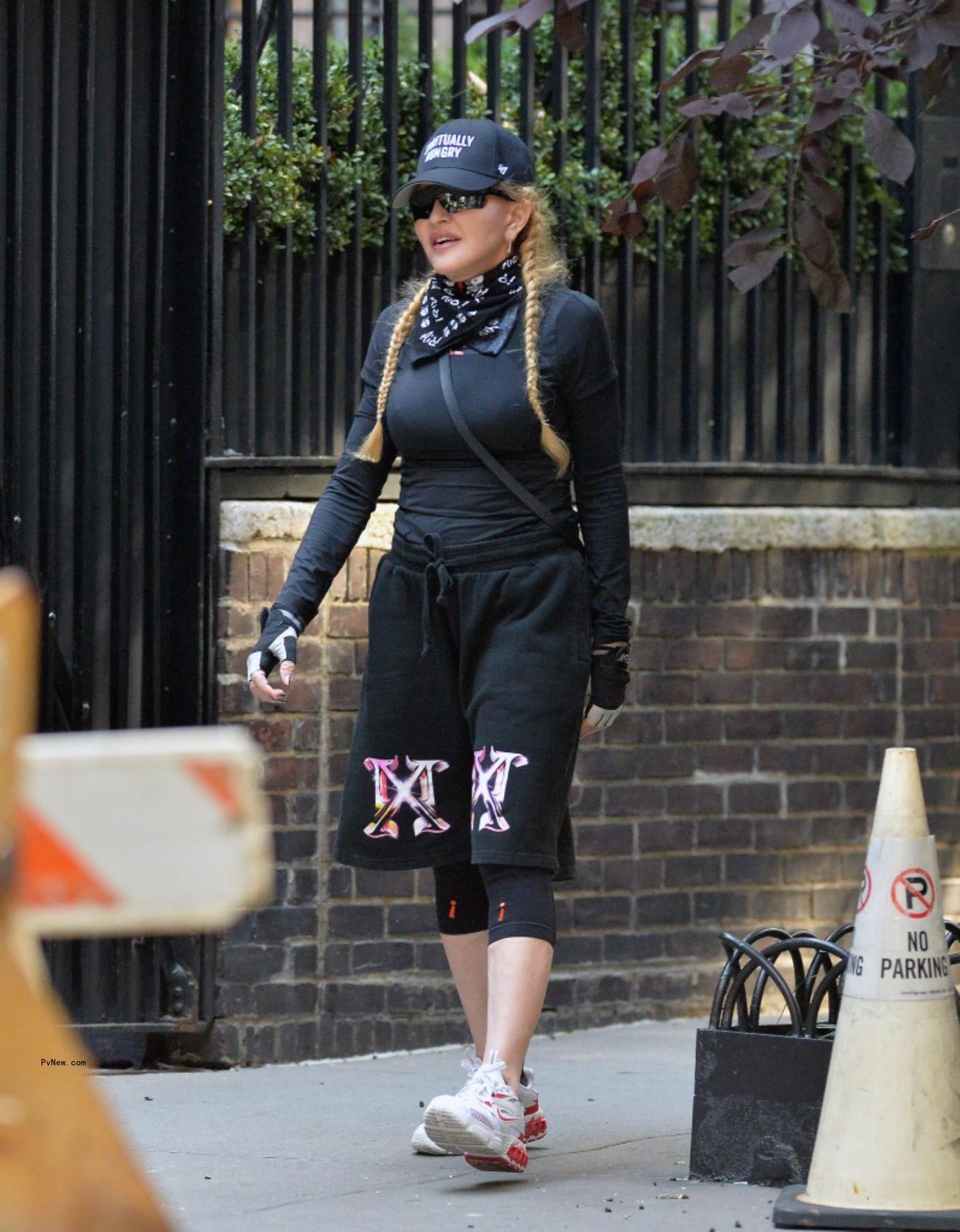Mado<i></i>nna walking in New York City.