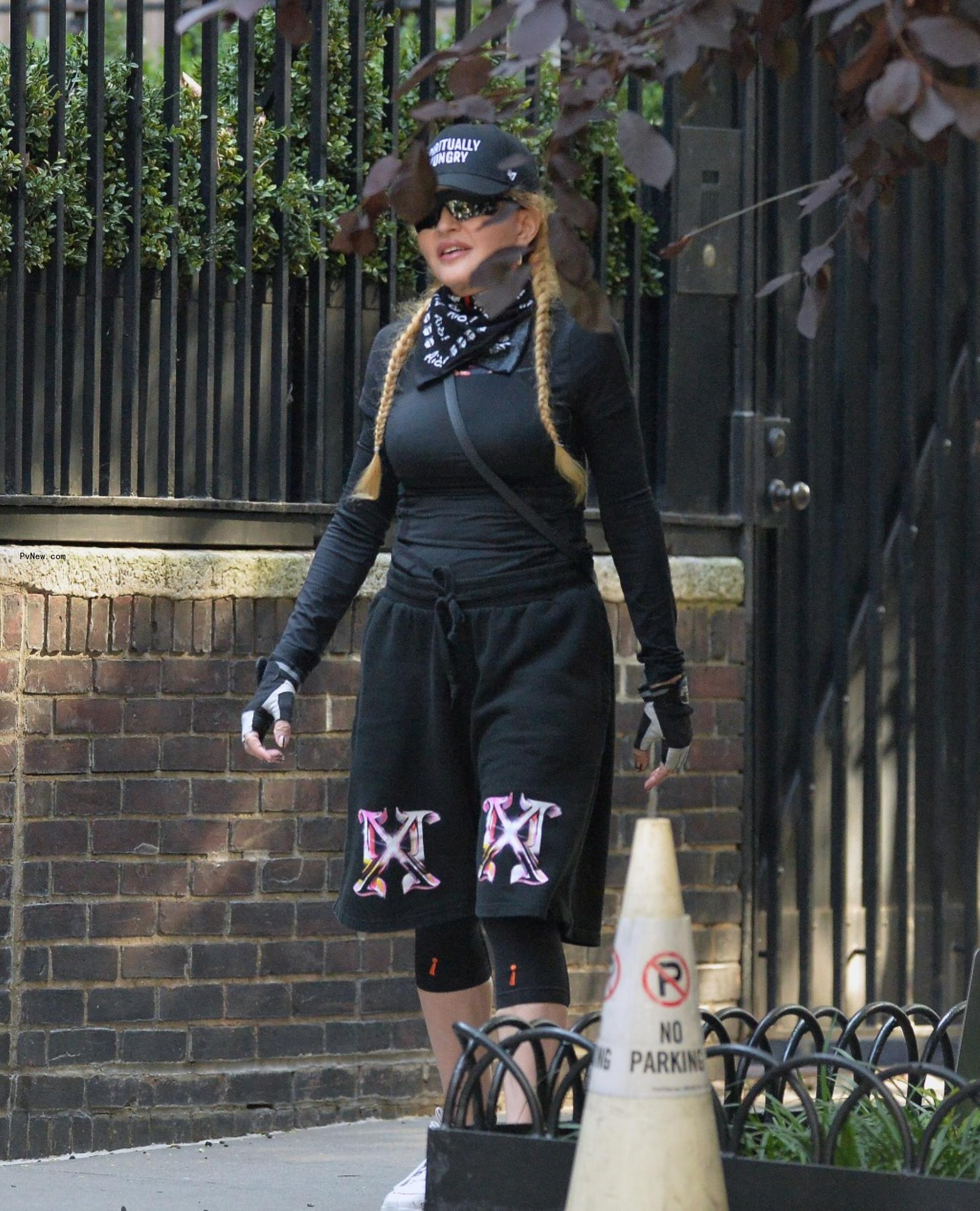 Mado<i></i>nna walking in New York City.