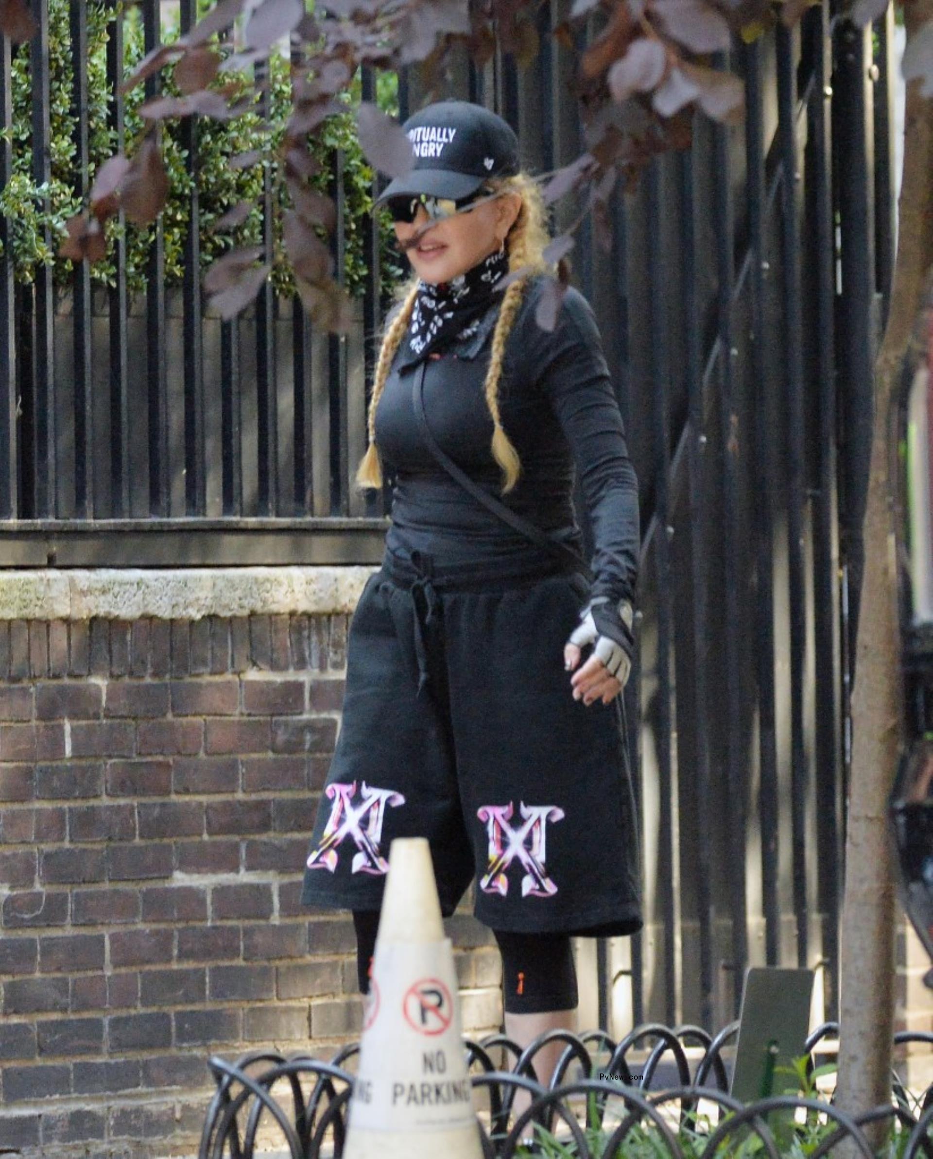 Mado<i></i>nna walking in New York City.