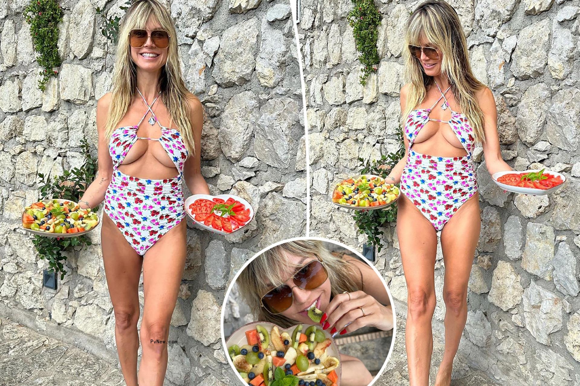 Heidi Klum serves fresh fruit (and underboob) in cutout swimsuit