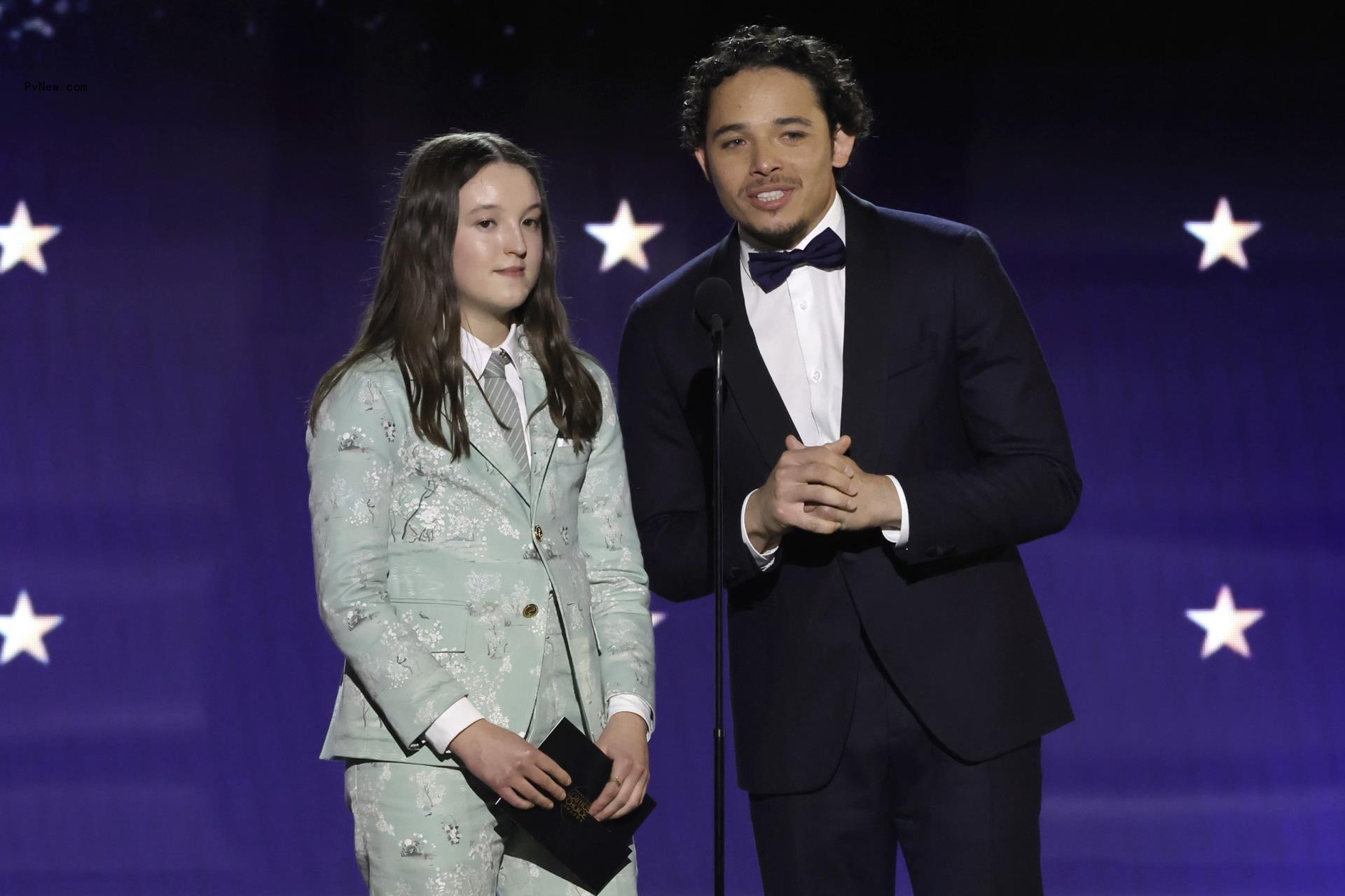 Bella Ramsey and Trevor Noah o<i></i>nstage at the 2024 Critics Choice Awards.