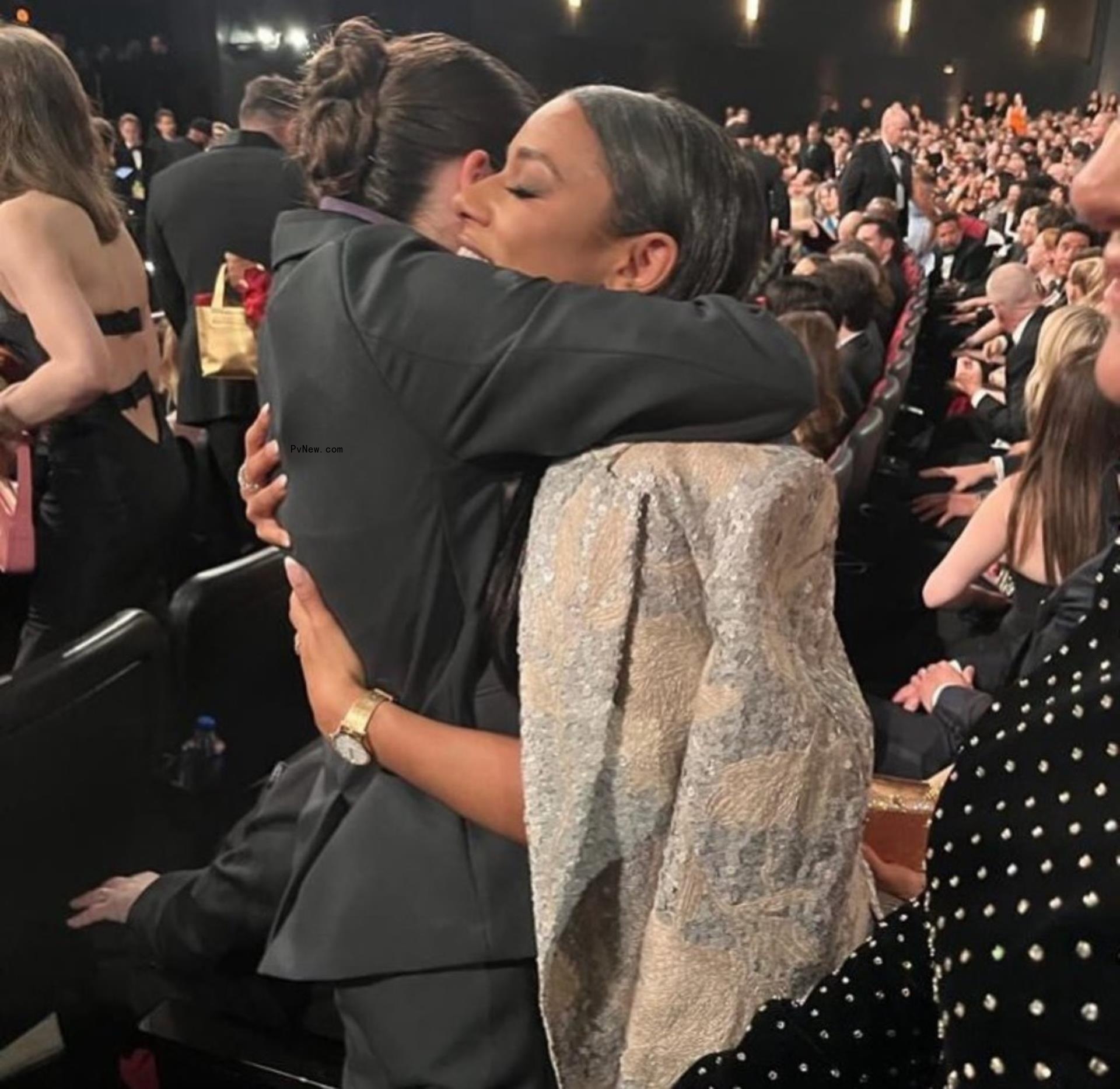 Ariana DeBose and Bella Ramsey hugging at the Emmys 2024.