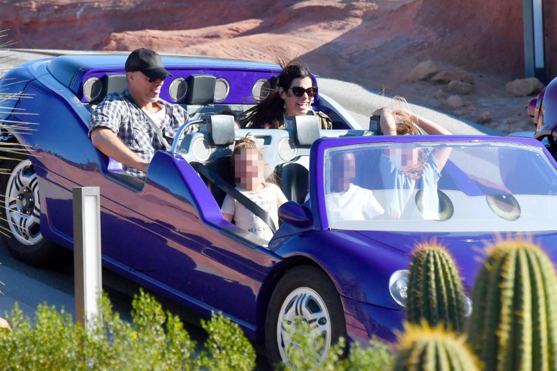 Bryan Randall, Sandra Bullock and their kids in a car.