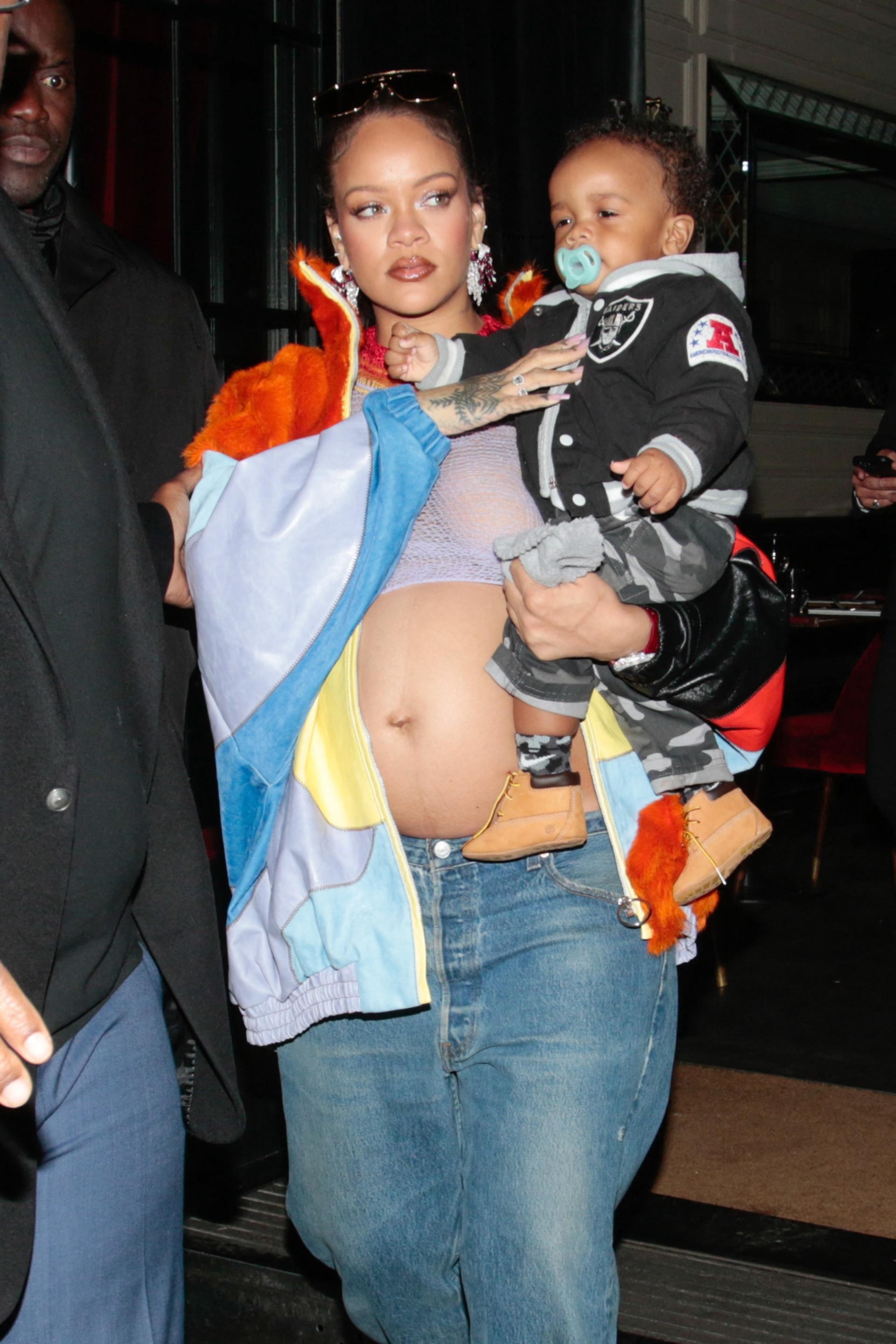 Rihanna carrying her son