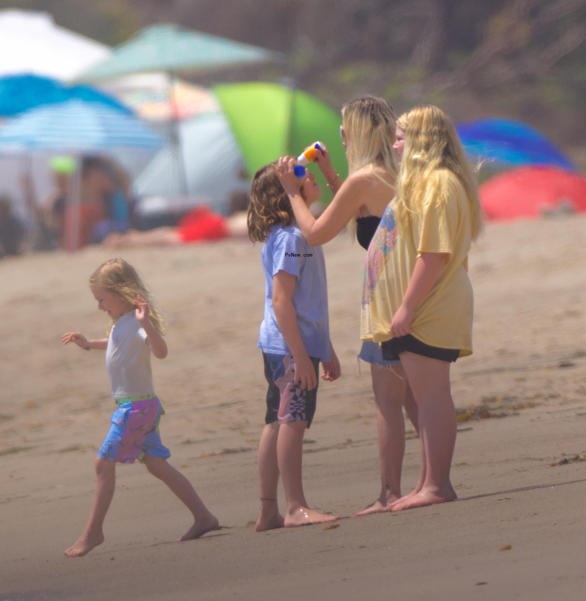 Tori Spelling and her kids at the beach