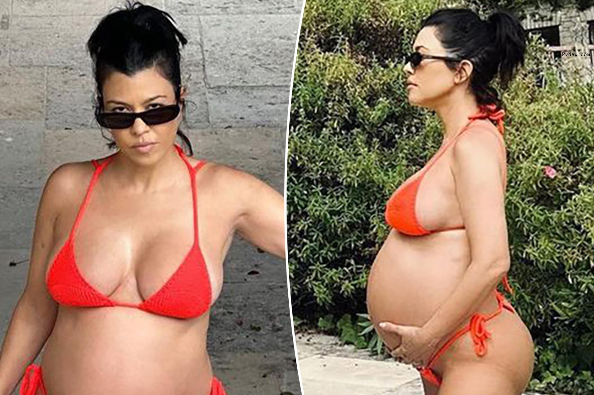 Pregnant Kourtney Kardashian cradles baby bump in red-hot string bikini