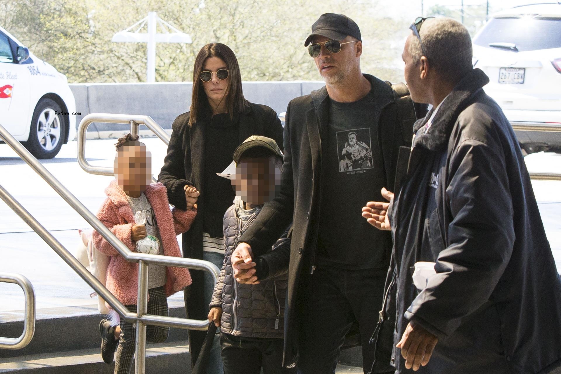 Sandra Bullock, her children, Louis and Laila, and Bryan Randall at the airport.