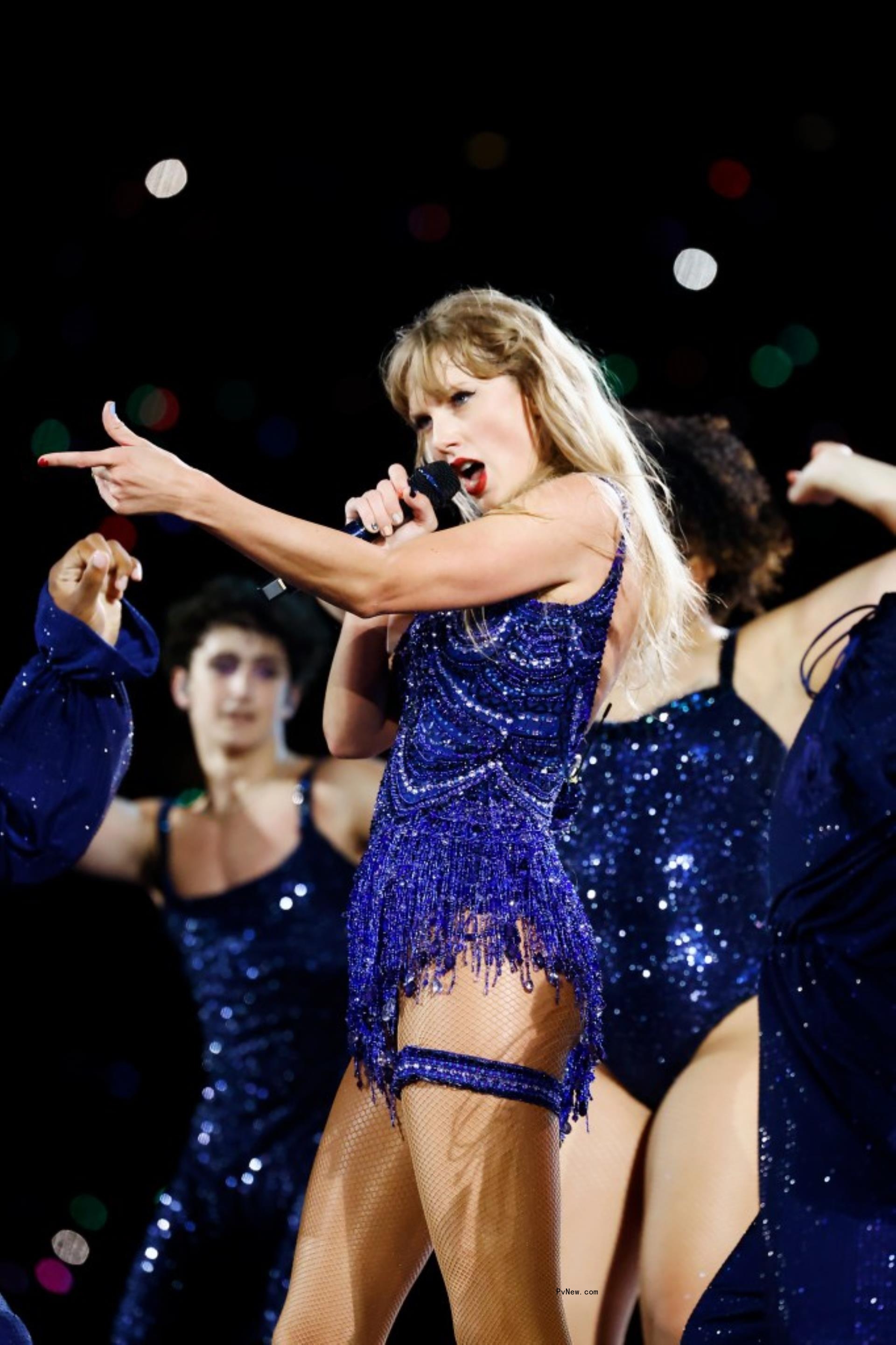 Taylor Swift performing onstage.