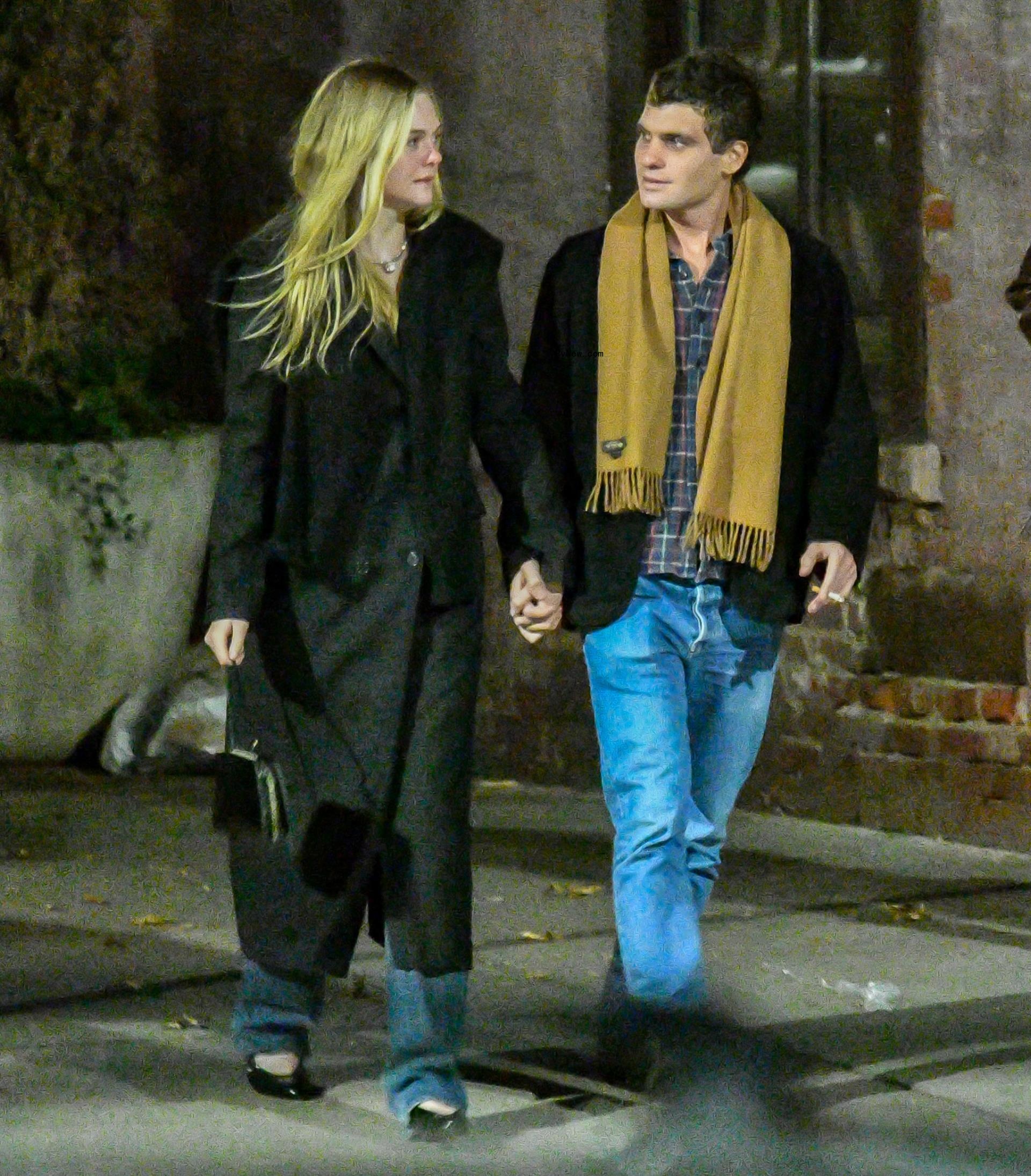 elle fanning and gus wenner holding hands.