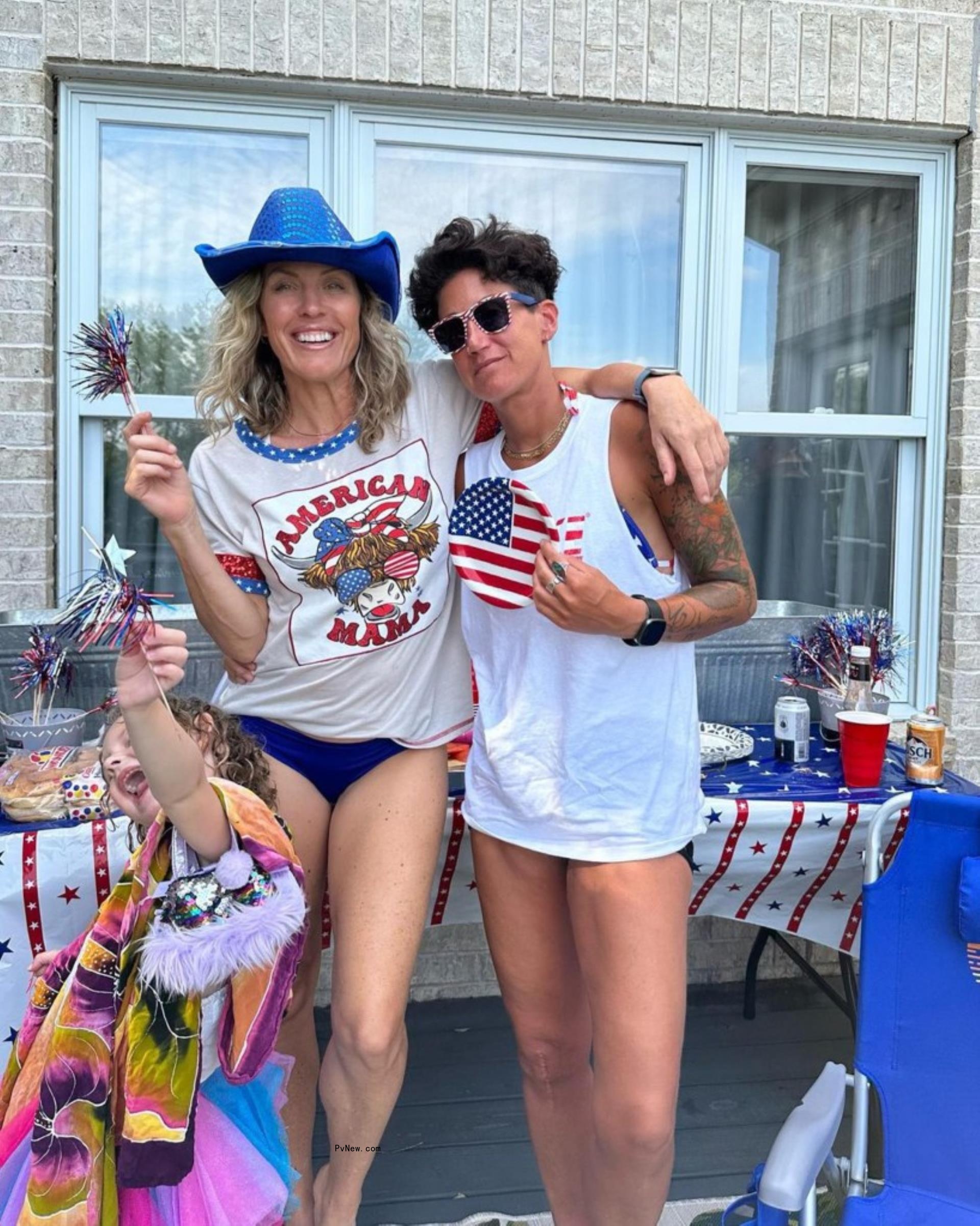 braunwyn windham-burke and fiancé jennifer spinner decked out in patriotic merchandise with one of her daughters in front