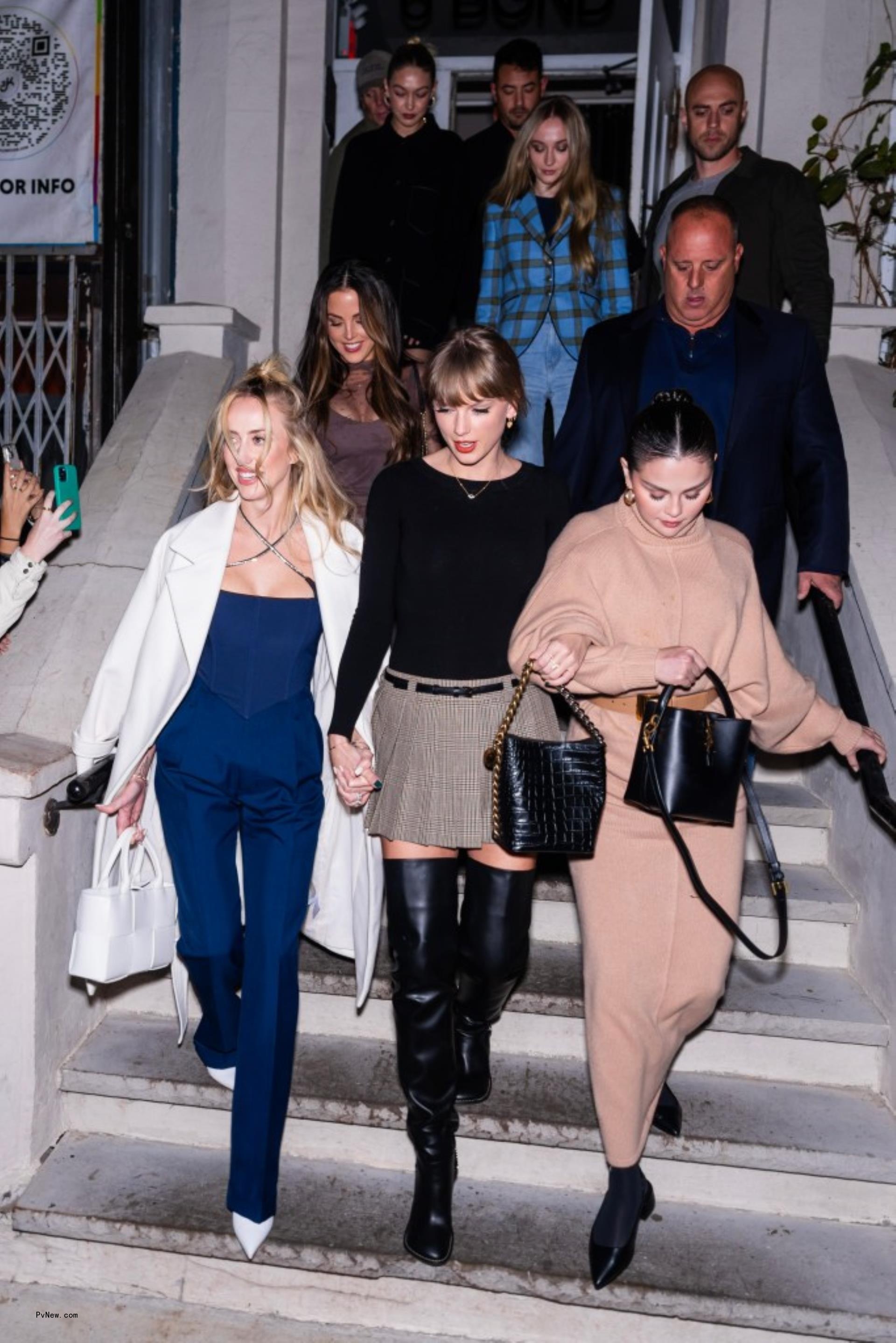 Brittany Mahomes, Taylor Swift, Selena Gomez walking with Sophie Turner in the background