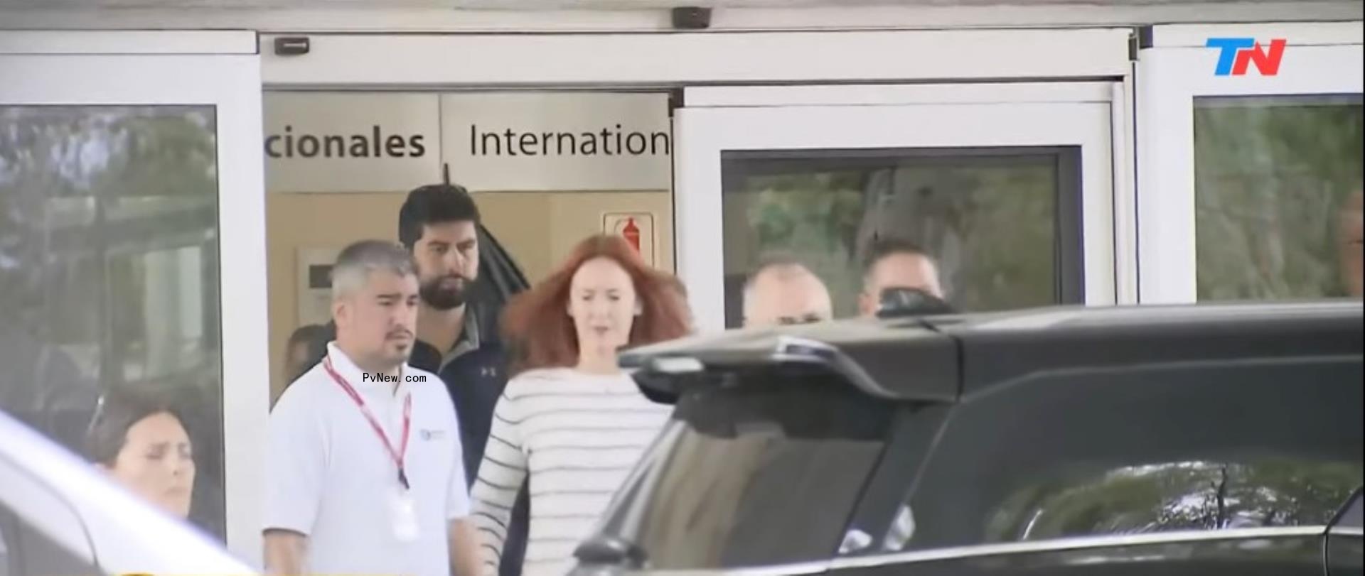 tree paine walking into an SUV