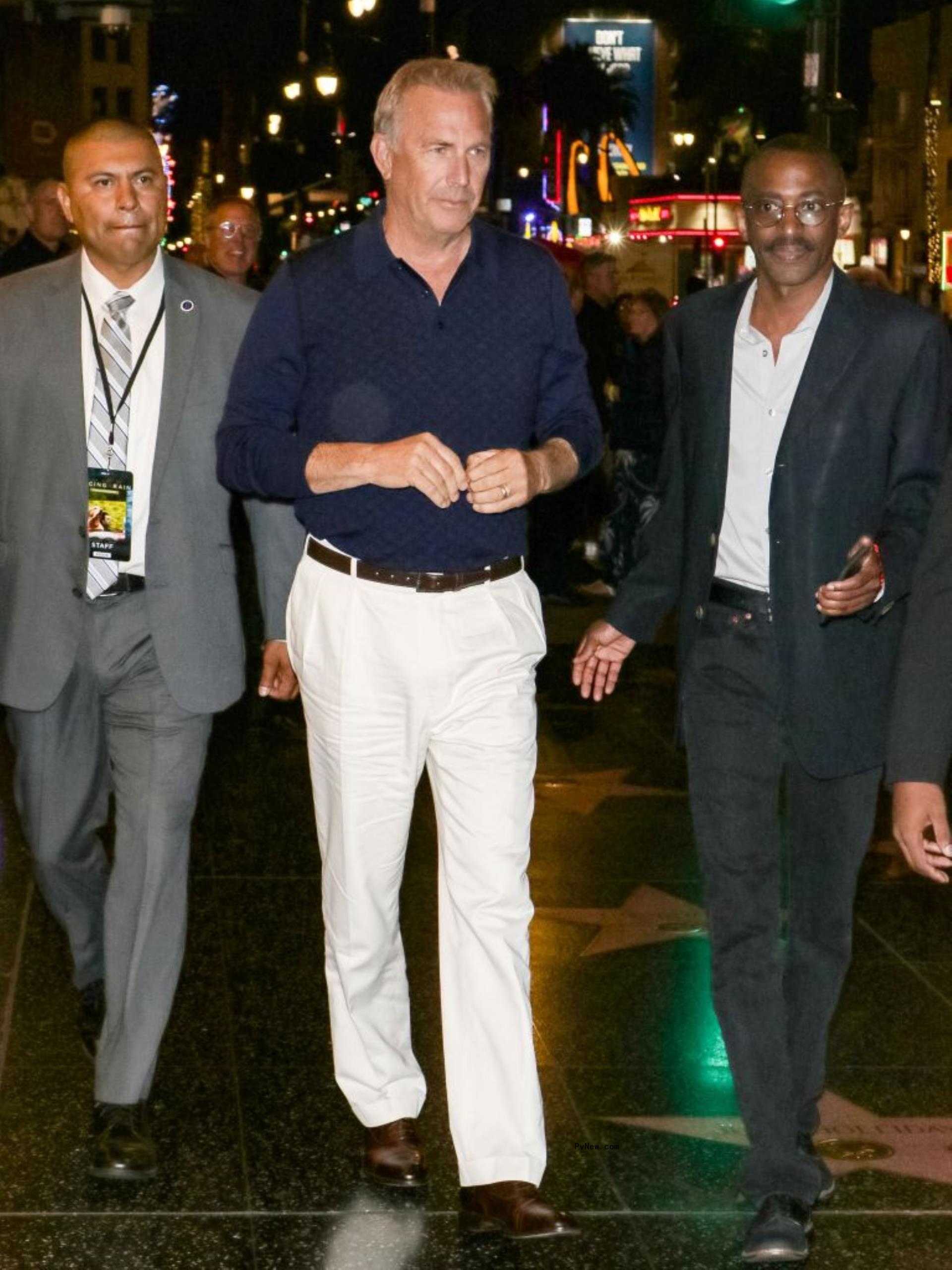 kevin costner with two bodyguards