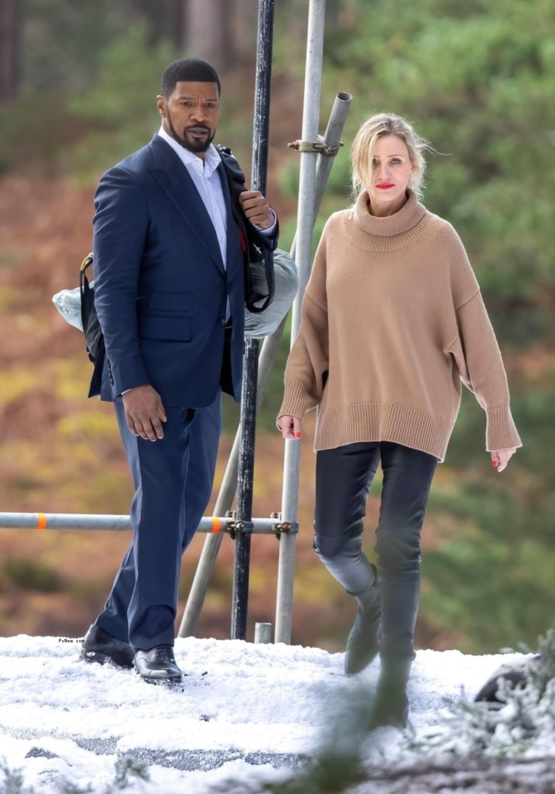 cameron diaz and jamie foxx standing on snow filming a movie