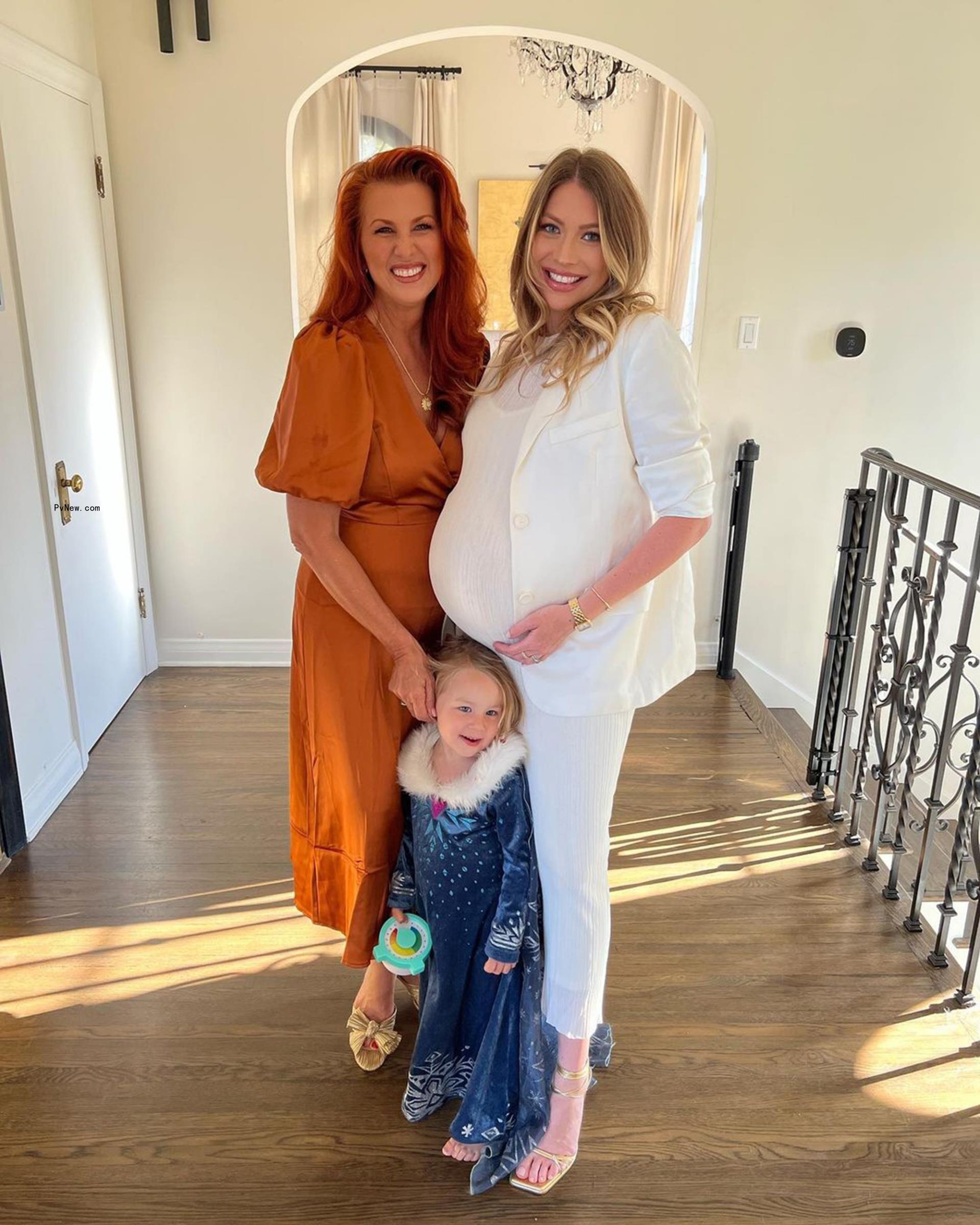 Stassi Schroeder posing for a photo with her mom and daughter