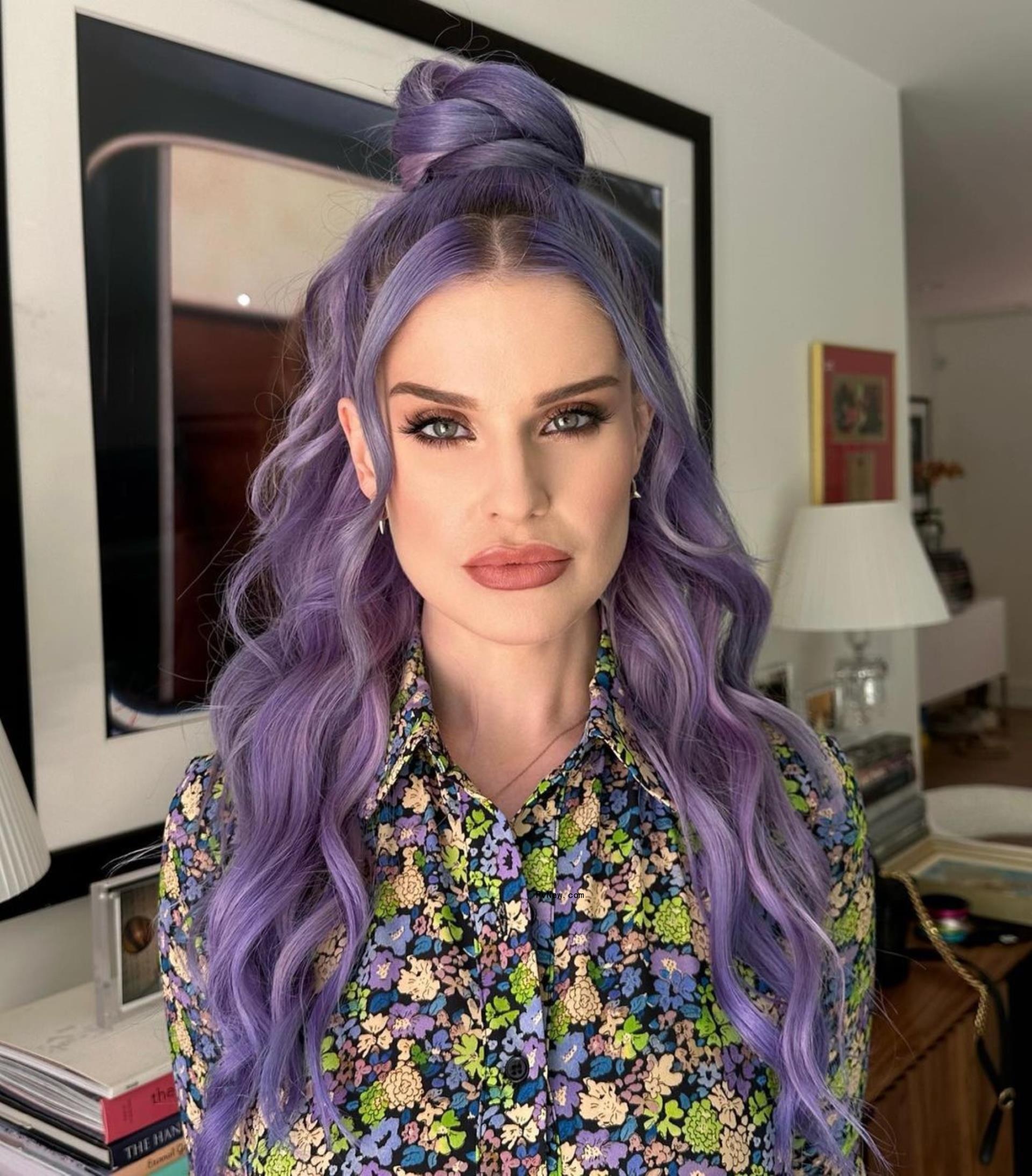 Kelly Osbourne with purple hair.