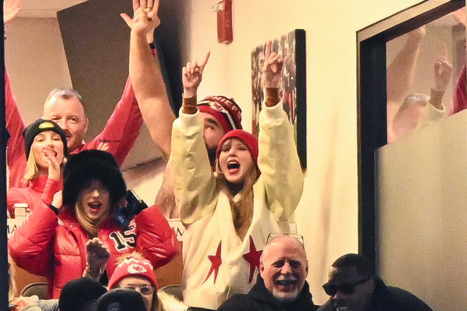 Taylor Swift cheering at Travis Kelce's game.
