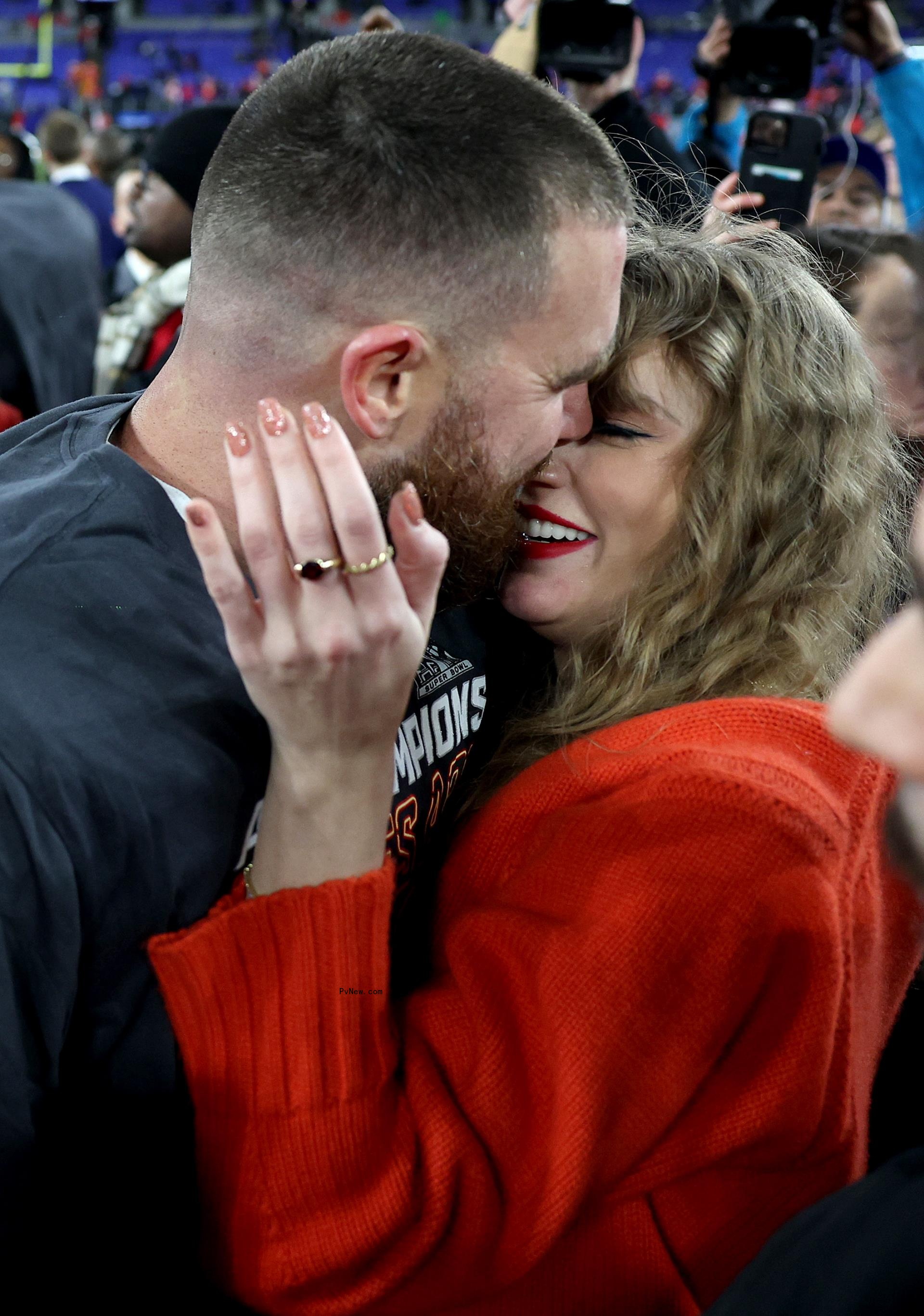 Travis Kelce #87 of the Kansas City Chiefs celebrates with Taylor Swift after a 17-10 victory against the Baltimore Ravens in the AFC Champio<i></i>nship Game at M&T Bank Stadium on January 28, 2024 in Baltimore, Maryland.