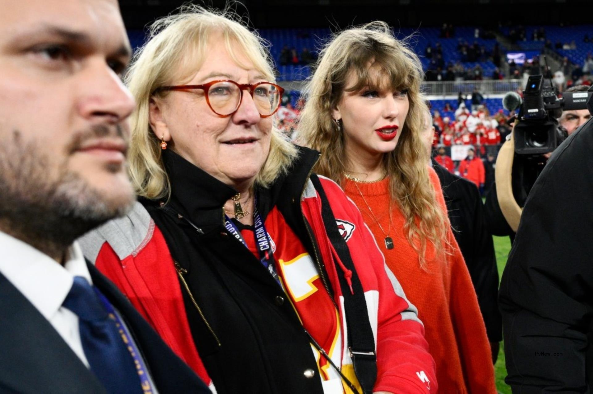 Taylor Swift, right, and Do<i></i>nna Kelce walk on the field after the Kansas City Chiefs won the AFC Champio<i></i>nship NFL football game against the Baltimore Ravens, Sunday, Jan. 28, 2024, in Baltimore. 