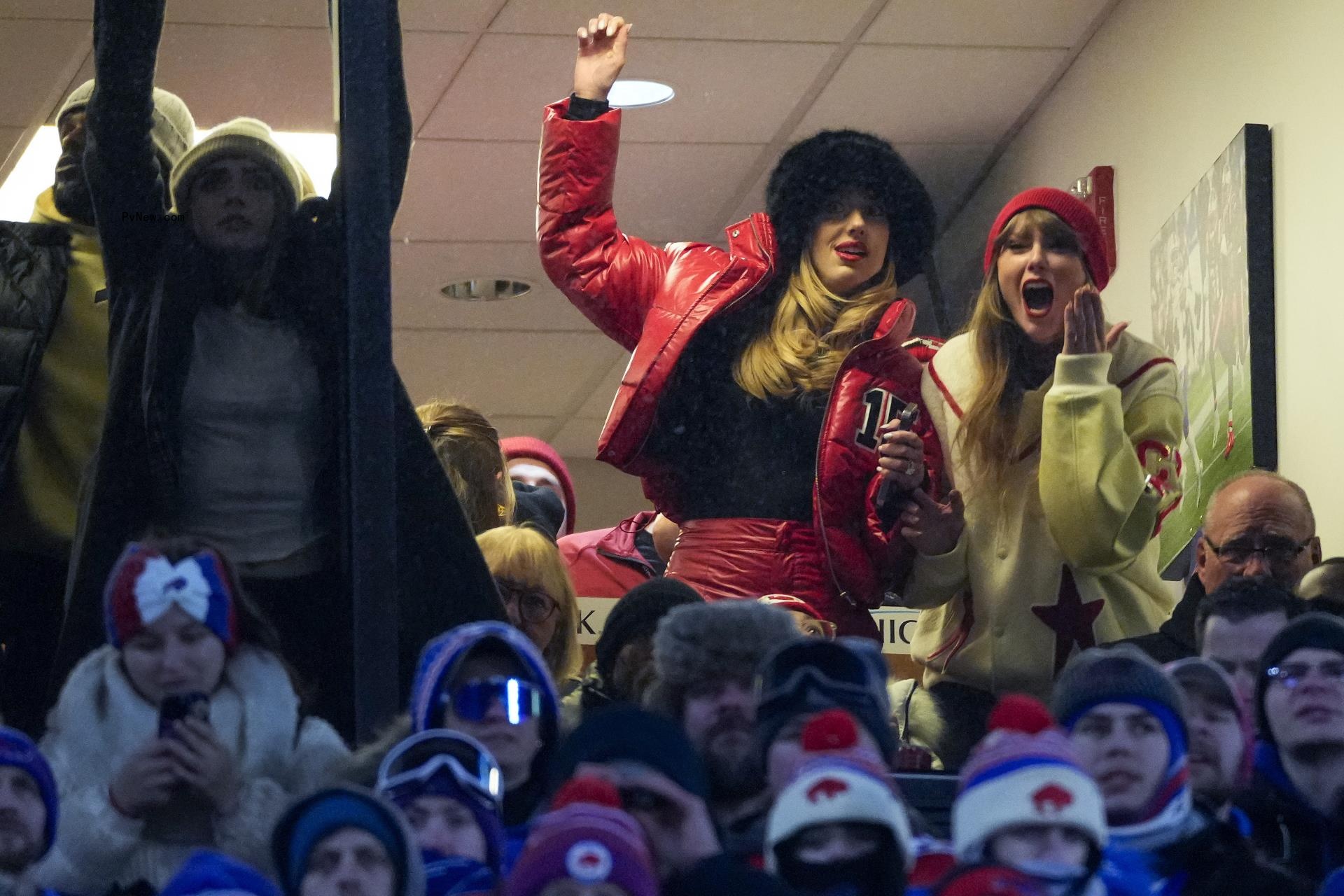 Taylor Swift and Brittany Mahomes at a suite at an NFL game.