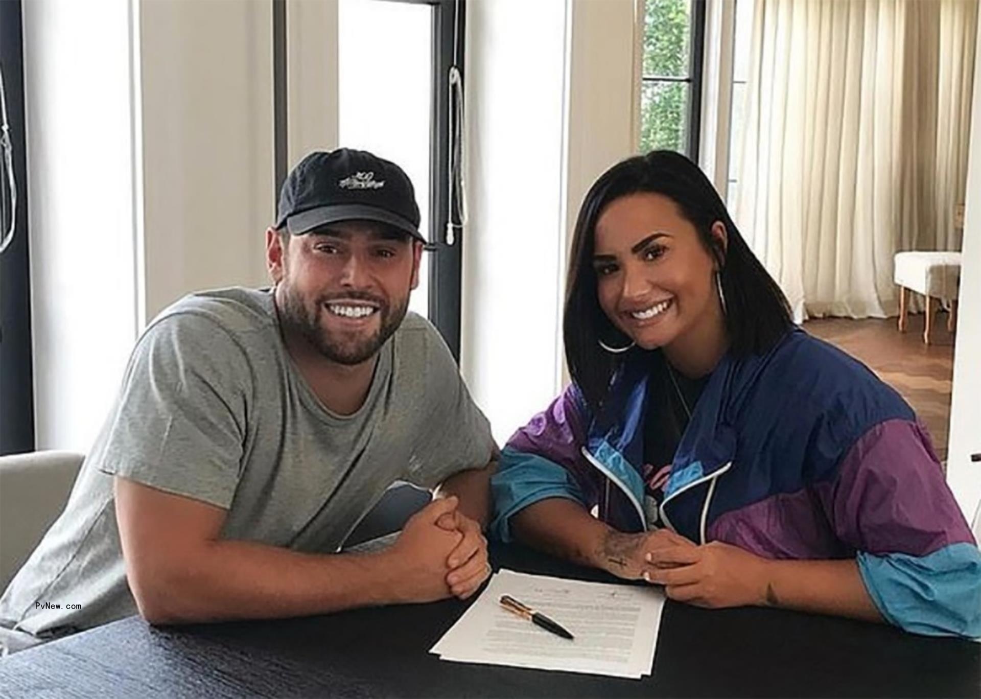 Scooter Braun and Demi Lovato