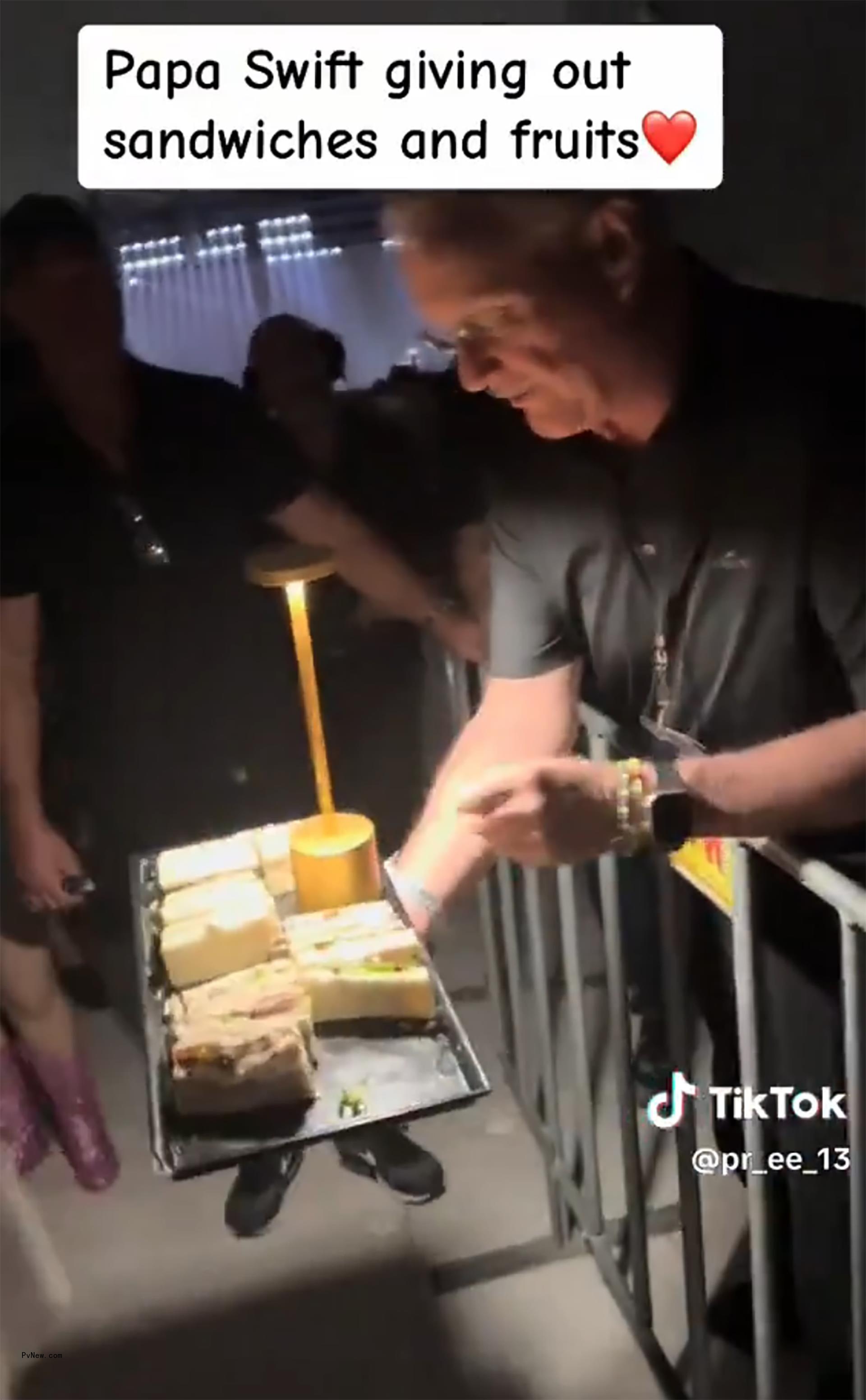 Scott Swift handing out sandwiches
