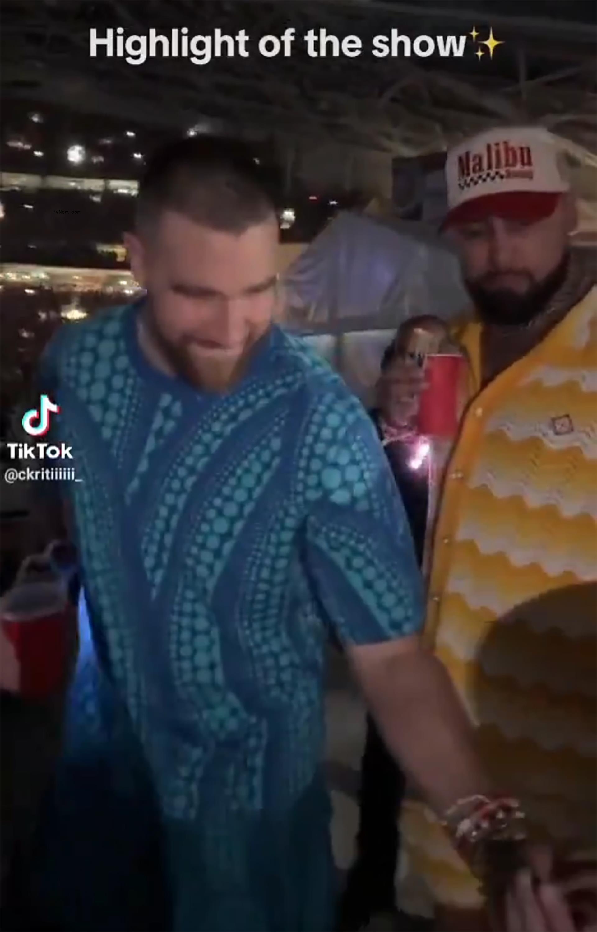 Travis Kelce at a co<i></i>ncert with pal Ross Travis.