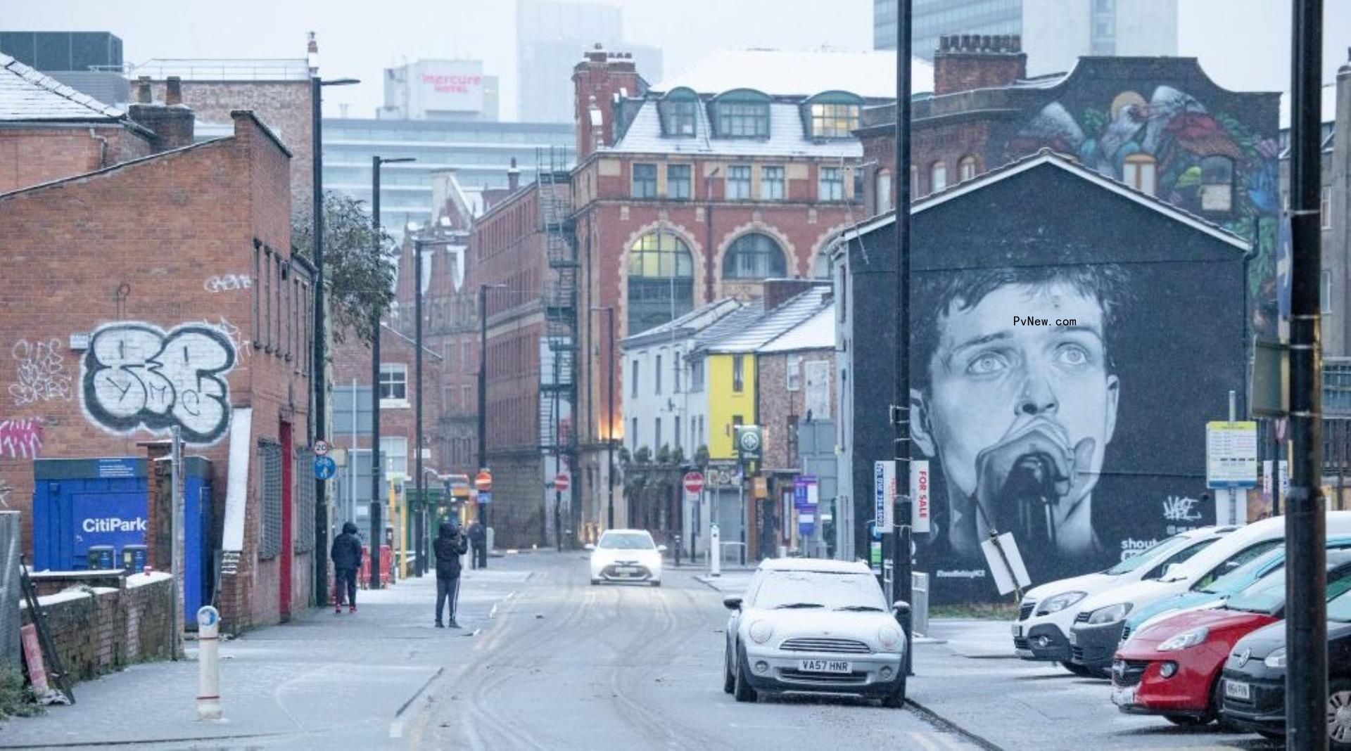 British Rapper Aitch Working to ‘Fix’ Manchester Mural of Joy Division’s Ian Curtis That Was Painted Over for His Album Advertisement
