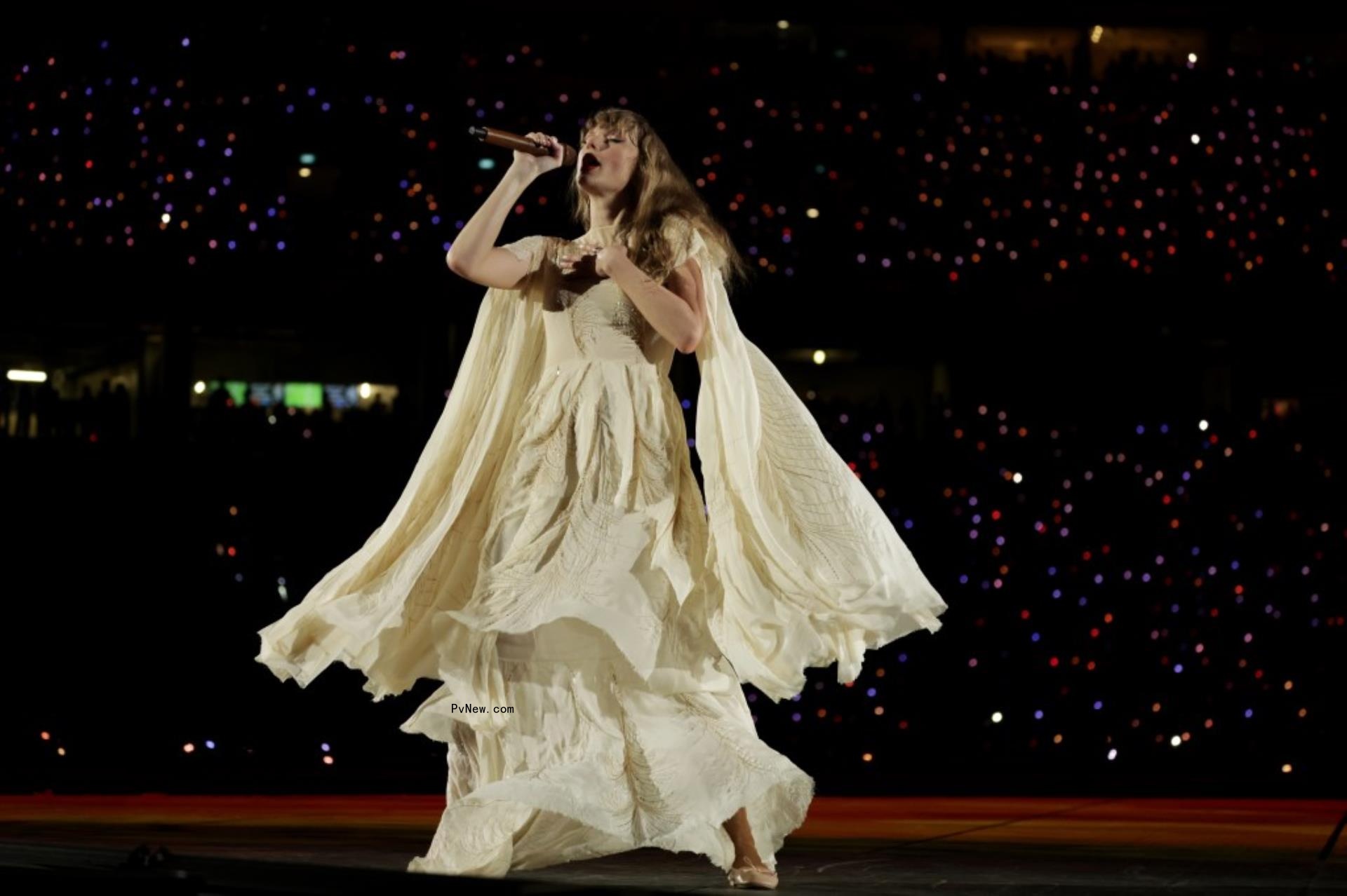Taylor Swift performing on stage.