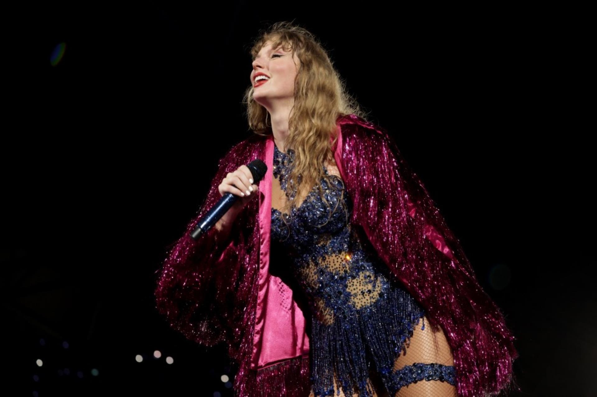 Taylor Swift performing on stage.