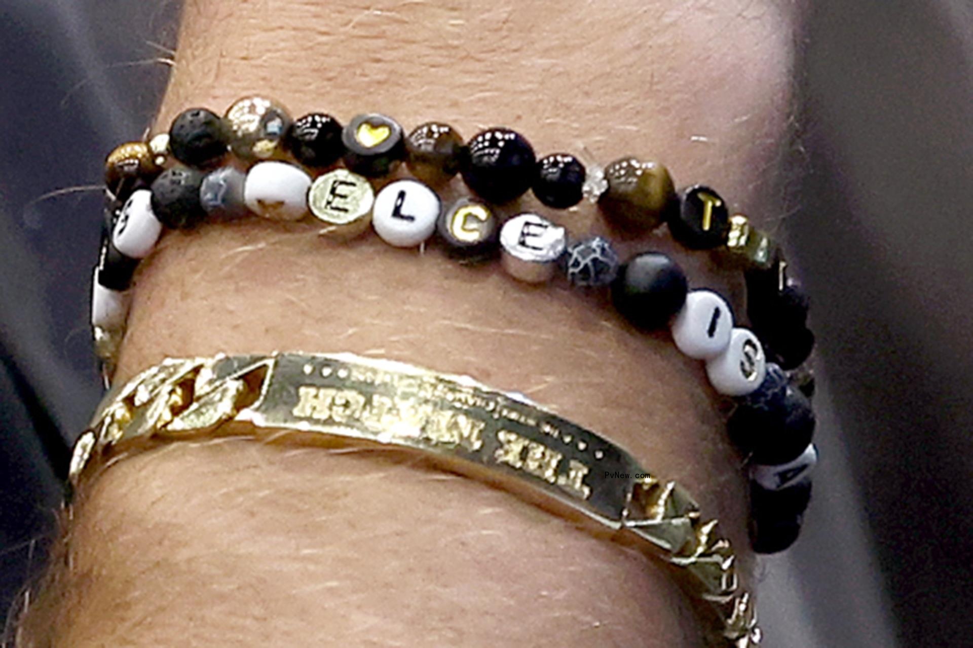 Travis Kelce's bracelets at Jason's retirement speech.