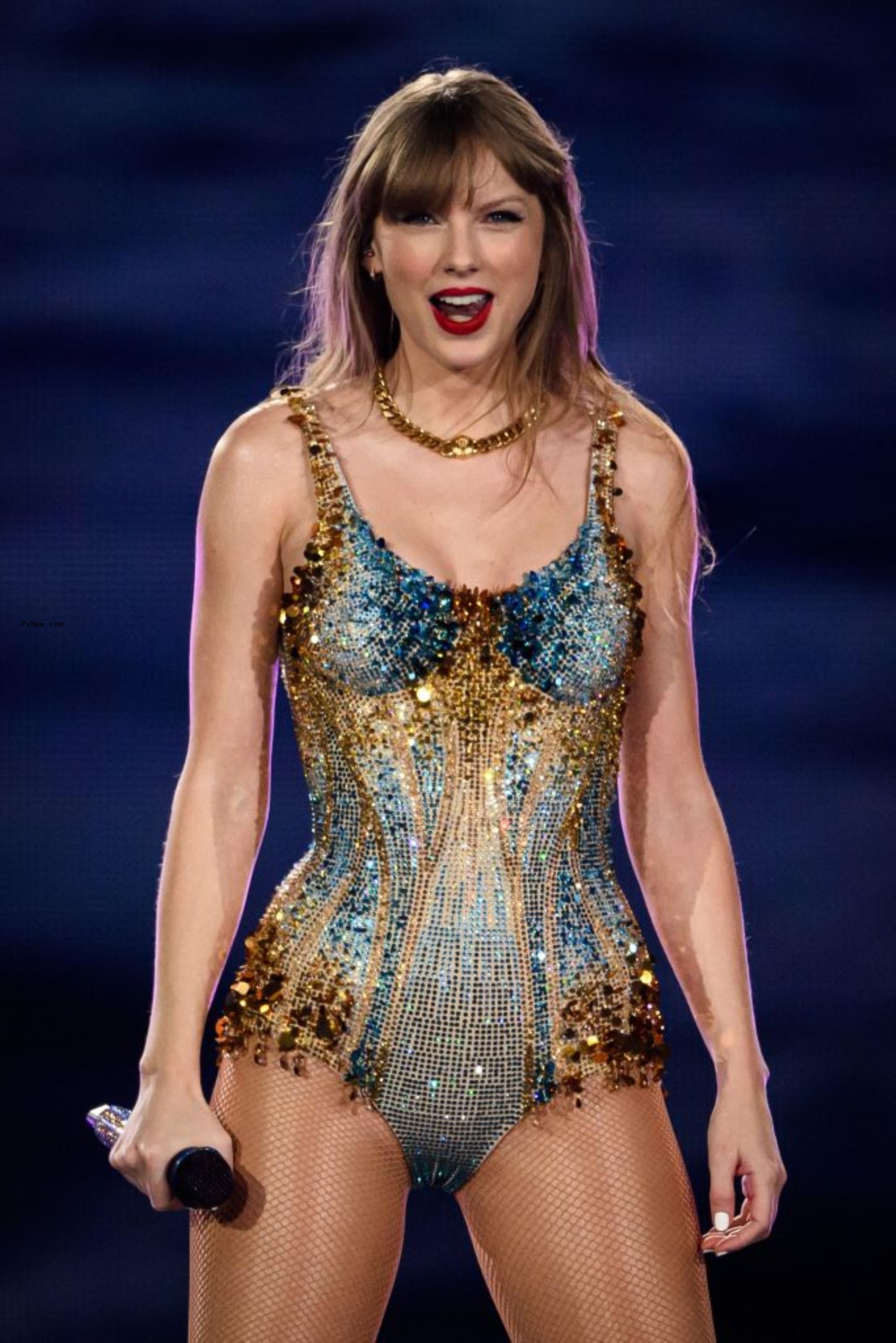 Taylor Swift performing on stage. 