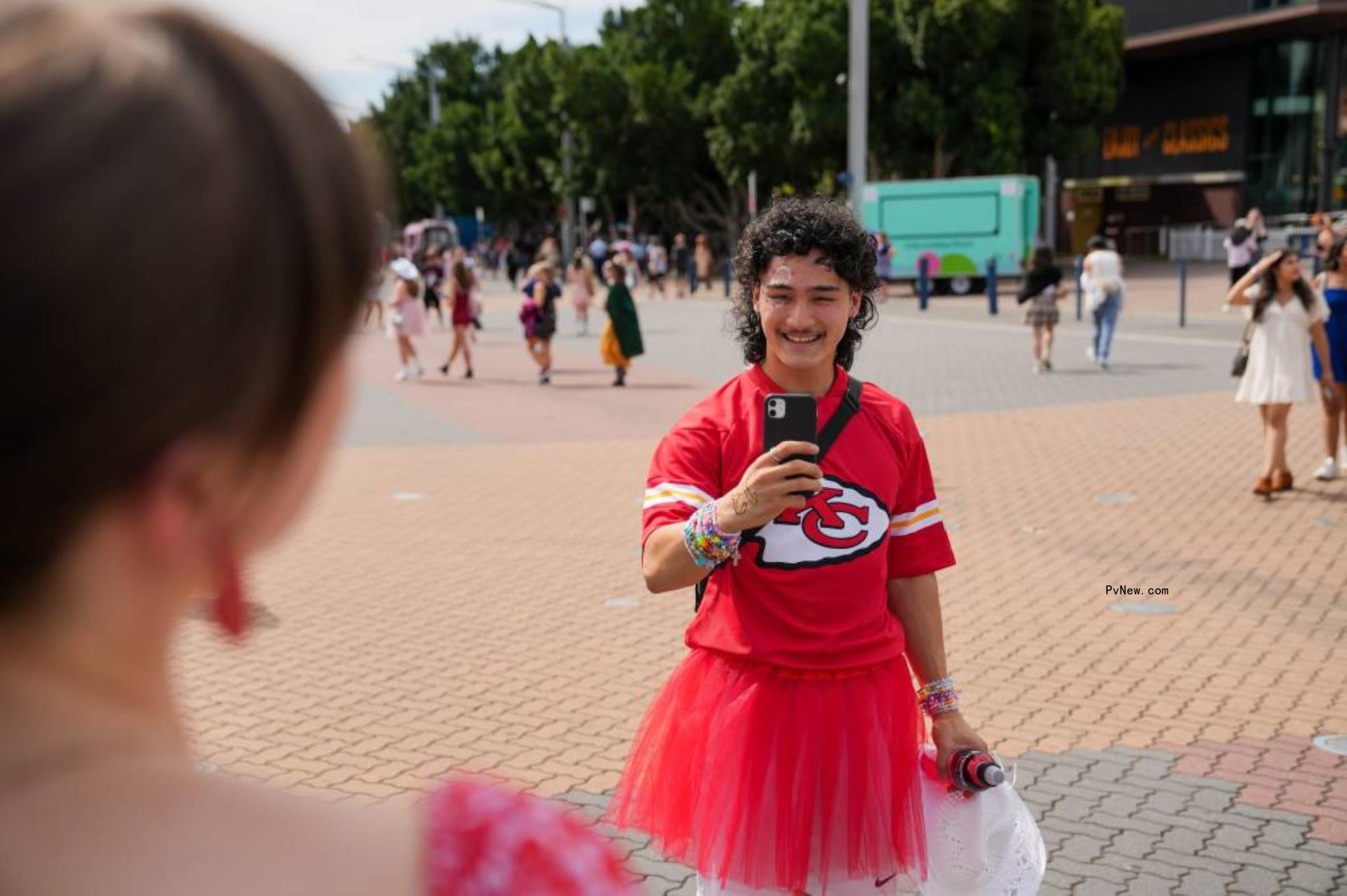 Swifties wearing Travis Kelce jerseys. 