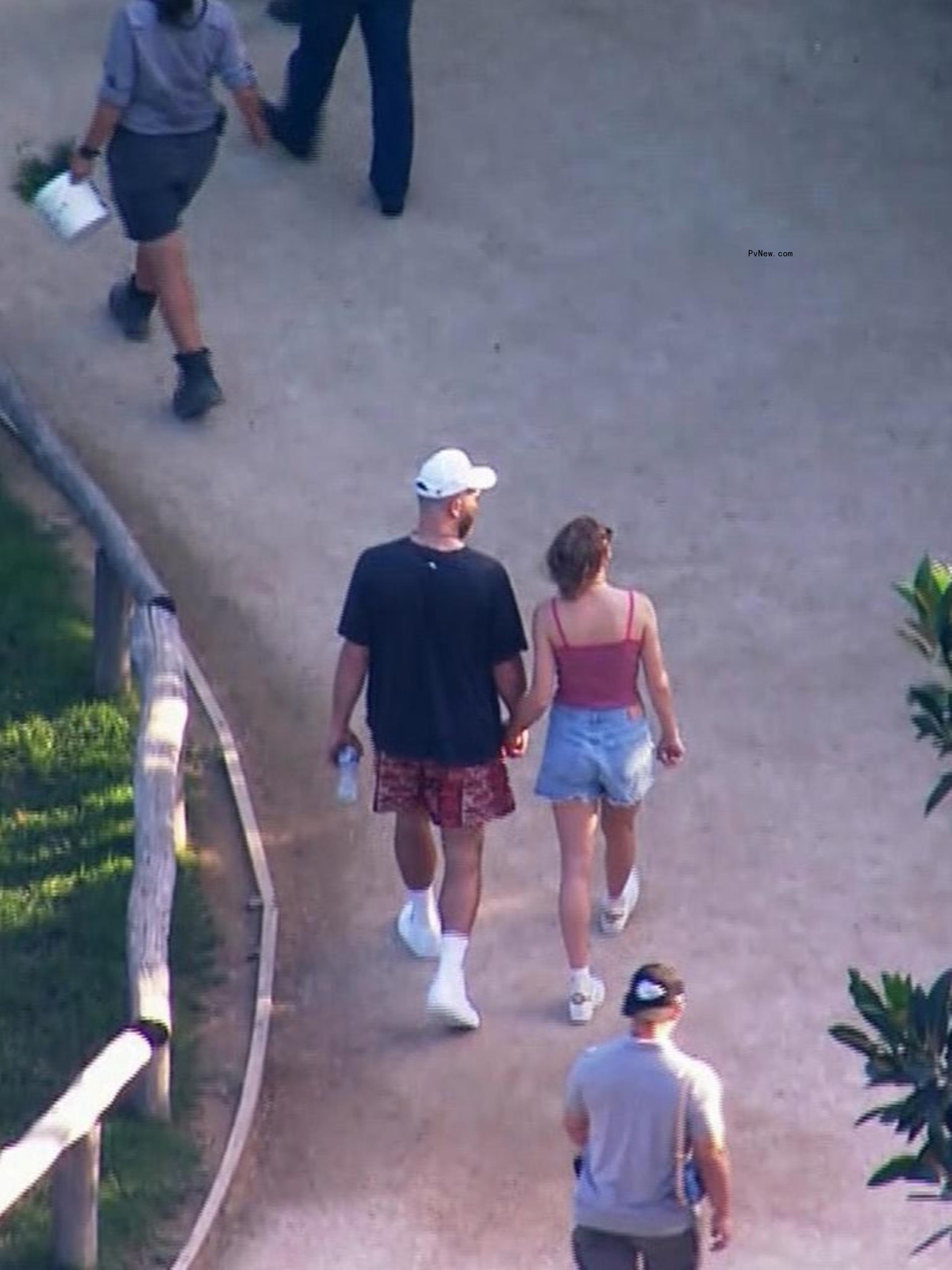 Travis Kelce and Taylor Swift holding hands at the Sydney Zoo